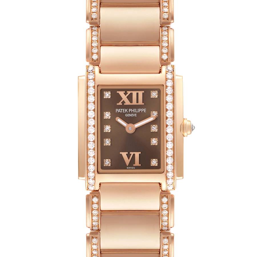 The Patek Philippe Twenty-4 watch is shown from a top-down angle, featuring the face, bezel, and part of the bracelet.