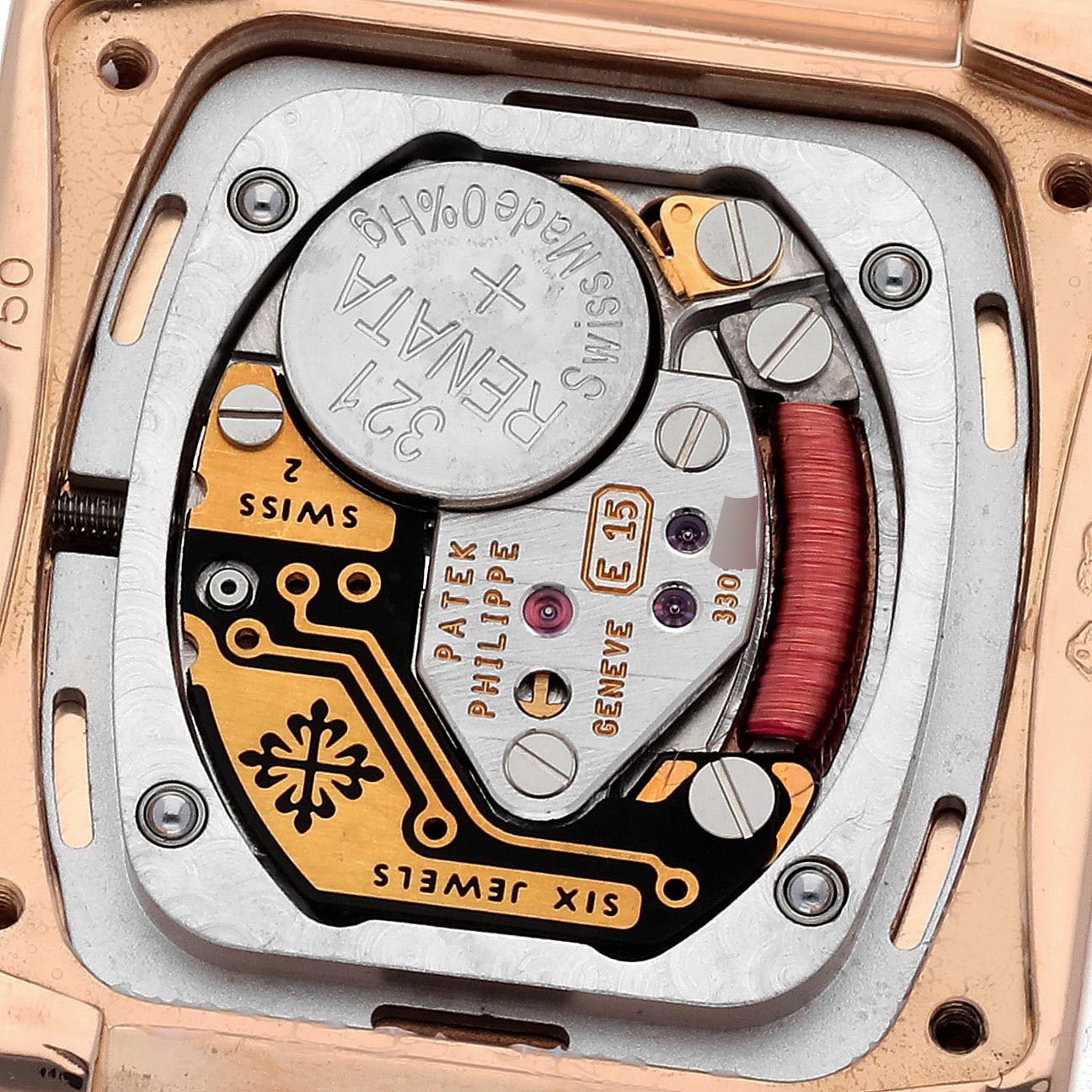 The image shows the movement mechanism of a Patek Philippe Twenty-4 4908/30R Women
s Rose Gold Brown Dial 4908/30R Women
s Rose Gold Brown Dial watch from a top-down angle.
