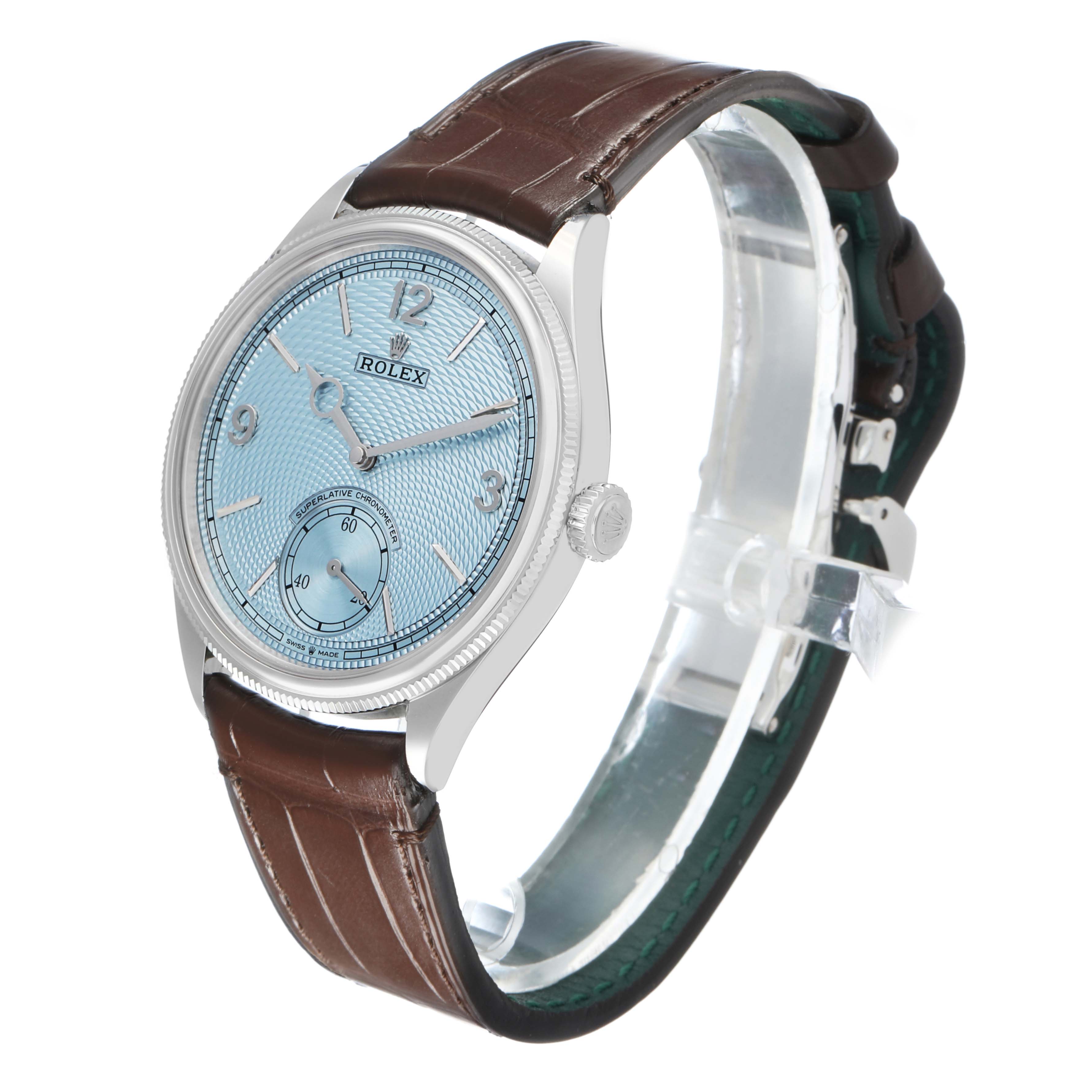 The Rolex 1908 52506 Men's Platinum Blue Dial model is shown at a three-quarter angle, highlighting the dial, bezel, crown, and leather strap.