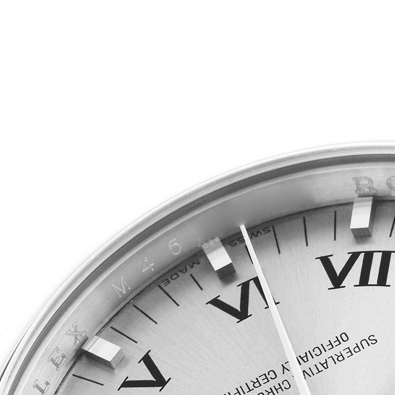 The image shows a partial view of the dial of a Rolex Air-King 114200 Men
s Stainless Steel Silver Dial 114200 Men
s Stainless Steel Silver Dial, focusing on the Roman numerals and the edge of the bezel.