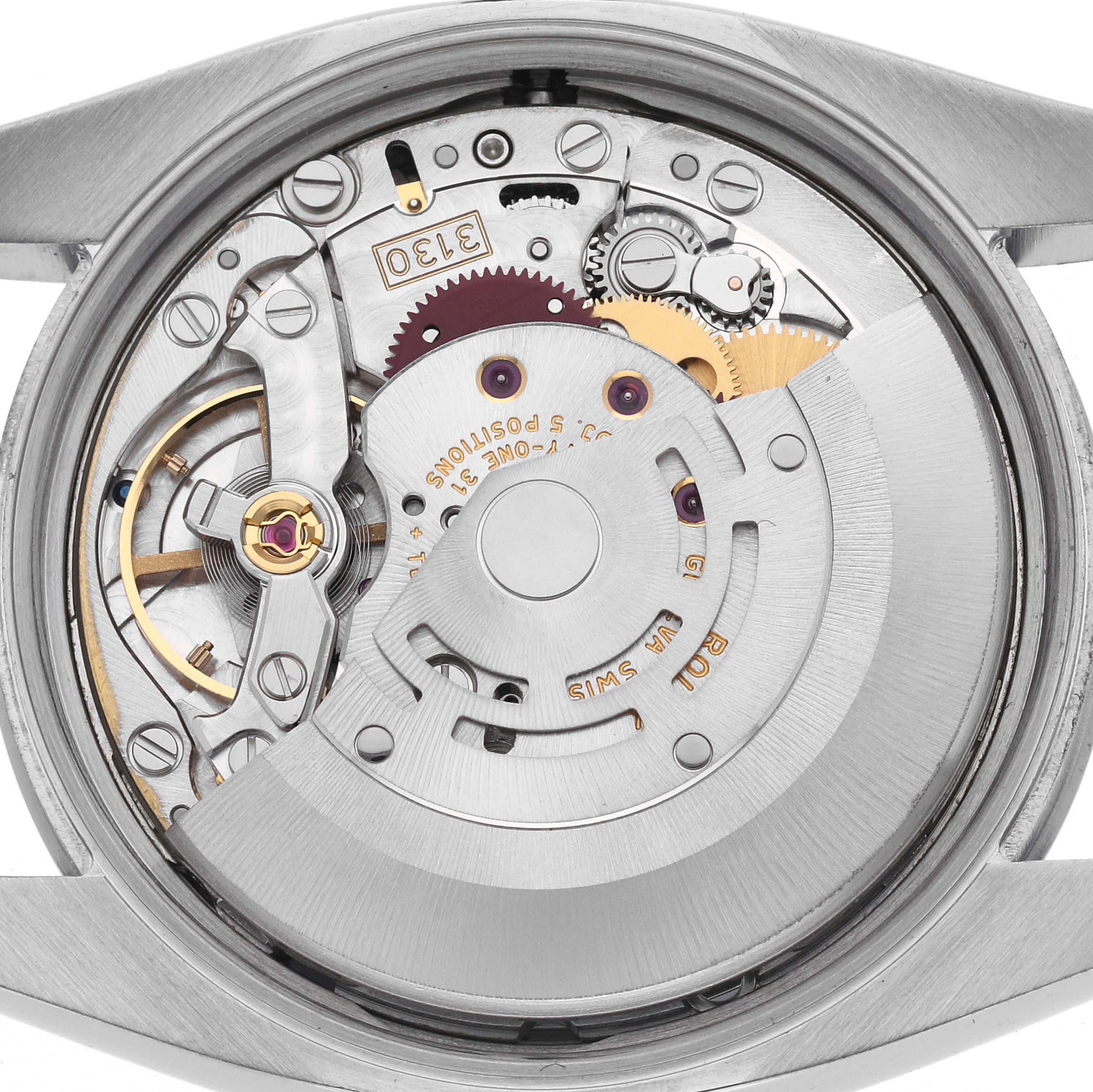 The image shows the back view of the Rolex Air-King 114200 Men
s Stainless Steel Silver Dial 114200 Men
s Stainless Steel Silver Dial, highlighting its intricate movement components.