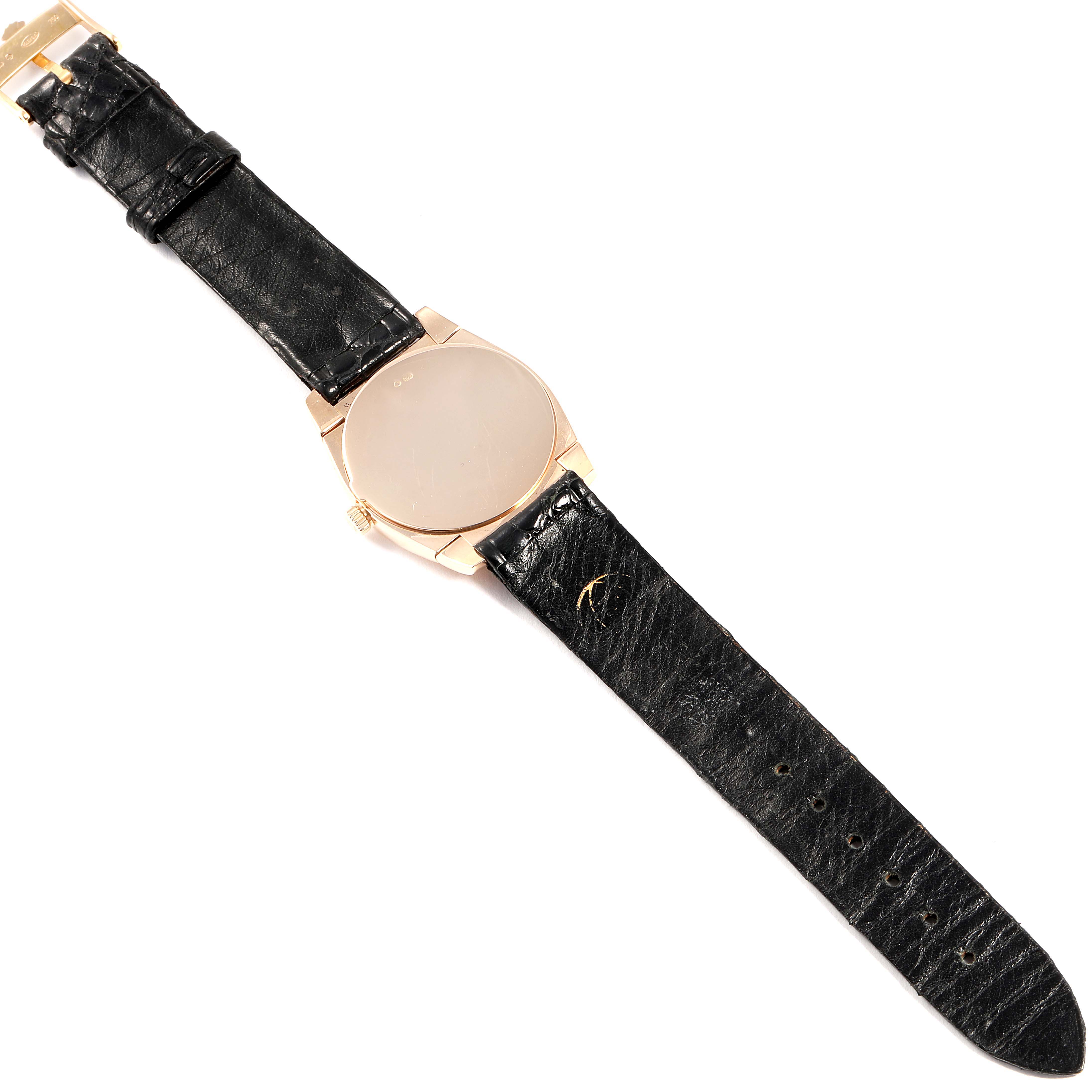 This image shows a top-down view of a Rolex Cellini 5330 Women's Rose Gold Grey Dial 5330 Women's Rose Gold Grey Dial watch, featuring its black leather strap and gold case.