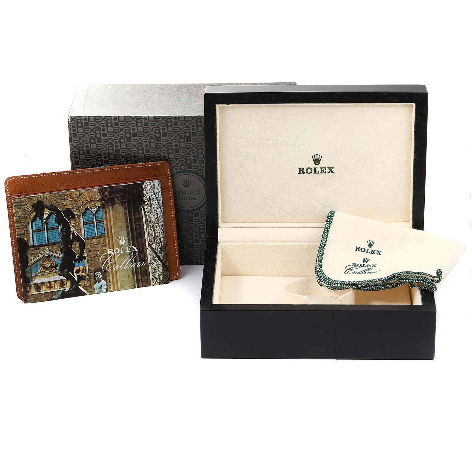 This image shows an open Cellini model Rolex watch box, a cleaning cloth, and a booklet.
