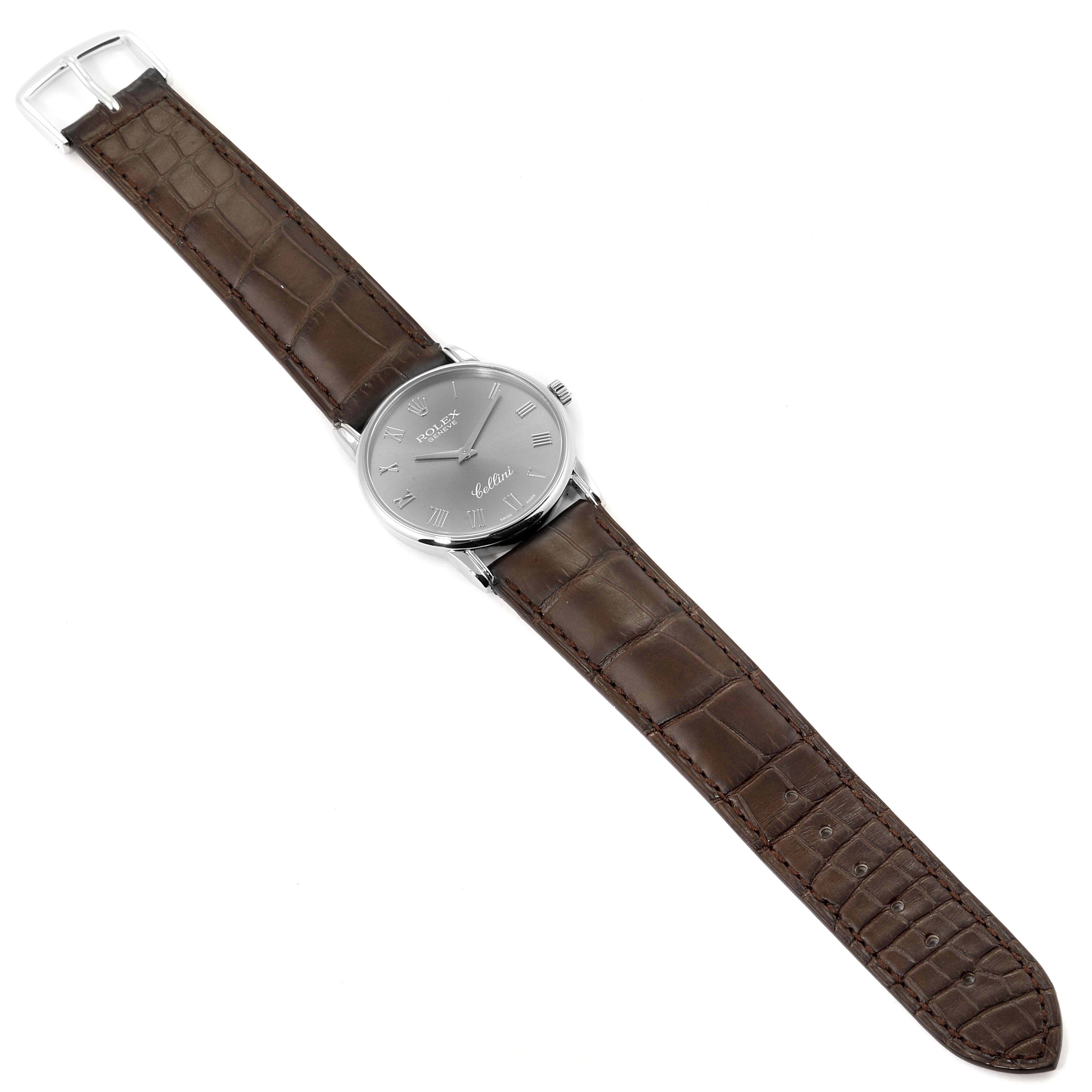 The Rolex Cellini 5116 Men's White Gold Grey Dial 5116 Men's White Gold Grey Dial watch is shown from the top, featuring the dial, case, crown, and a brown leather strap with a buckle.