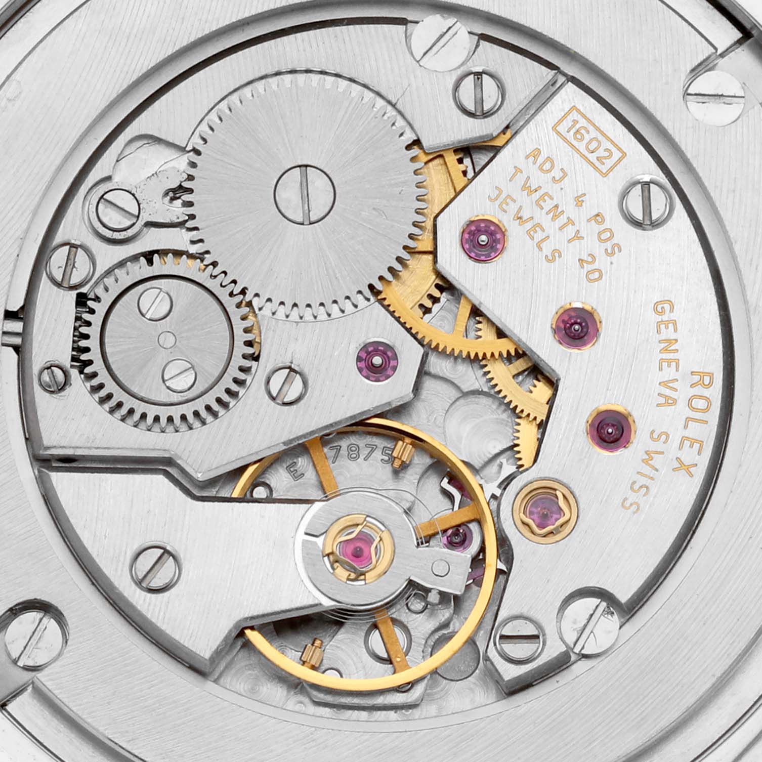 The image shows a close-up of the movement mechanism of the Rolex Cellini 5115 Men's White Gold White Dial 5115 Men's White Gold White Dial model watch, revealing gears and internal components.