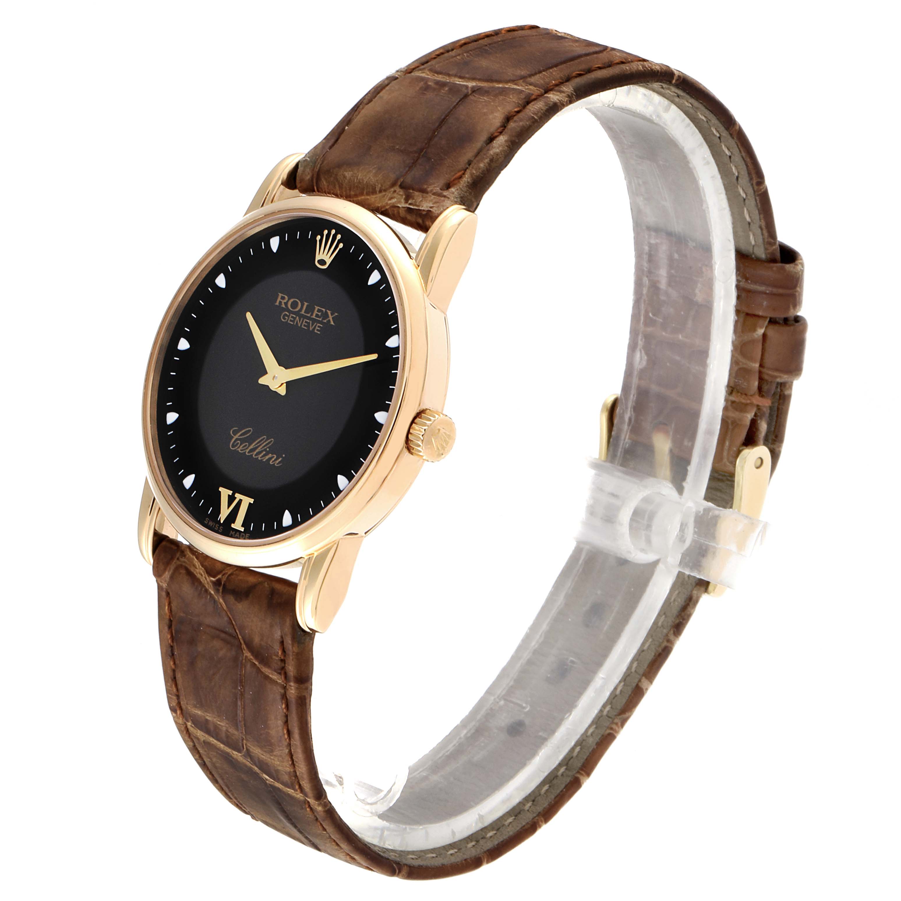 The Rolex Cellini 5116 Men's Yellow Gold Black Dial 5116 Men's Yellow Gold Black Dial watch is shown at a slight angle from the front, displaying its black dial, gold case, and brown leather strap.