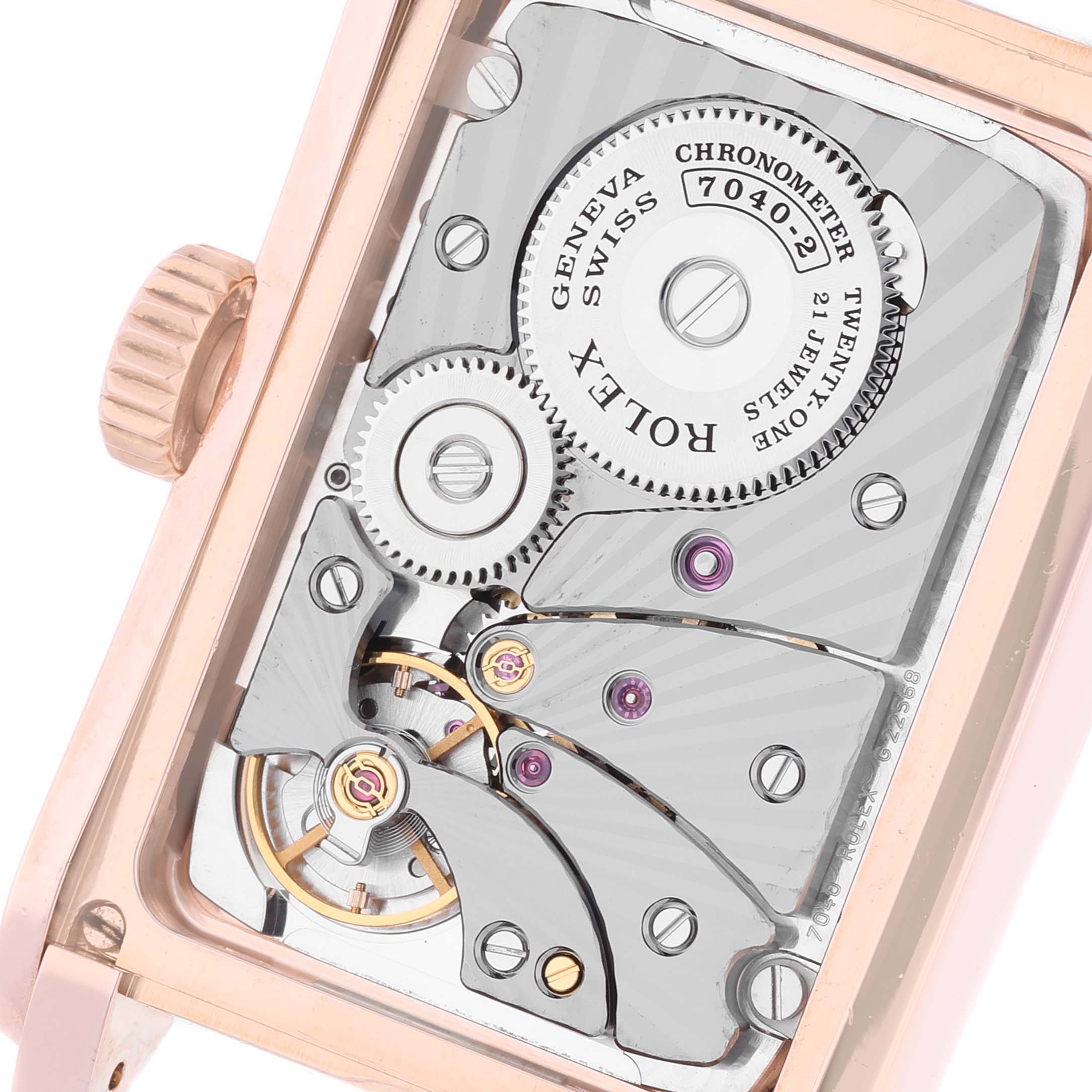 The image shows the movement from a rear angle of a Rolex Cellini 5442 Men
s Rose Gold Black Dial 5442 Men
s Rose Gold Black Dial watch, highlighting the gears and internal mechanisms.