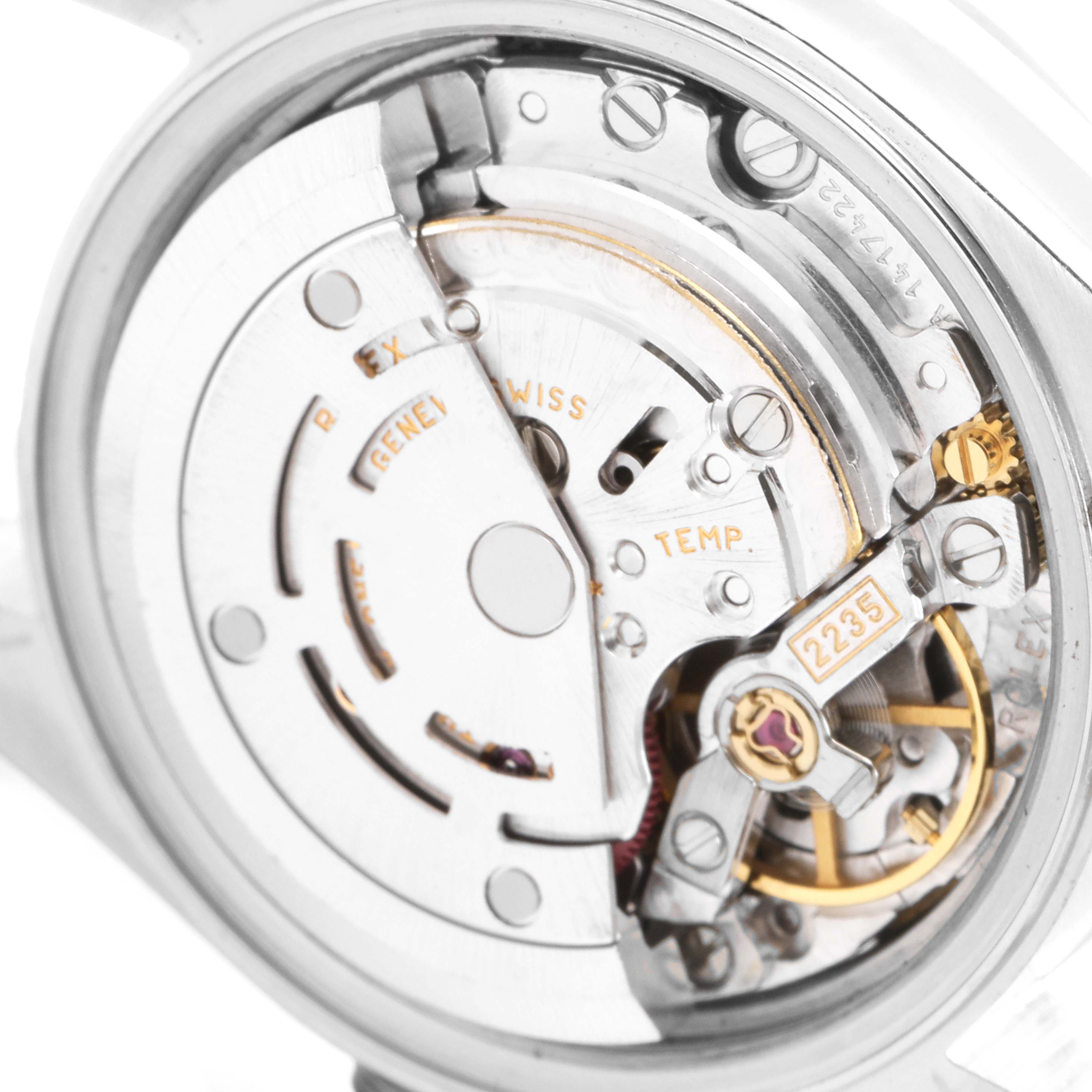 This image shows a close-up of the Rolex Date 79160 Women's Stainless Steel Pink Dial 79160 Women's Stainless Steel Pink Dial model watch's internal movement mechanism, including gears and inscriptions.