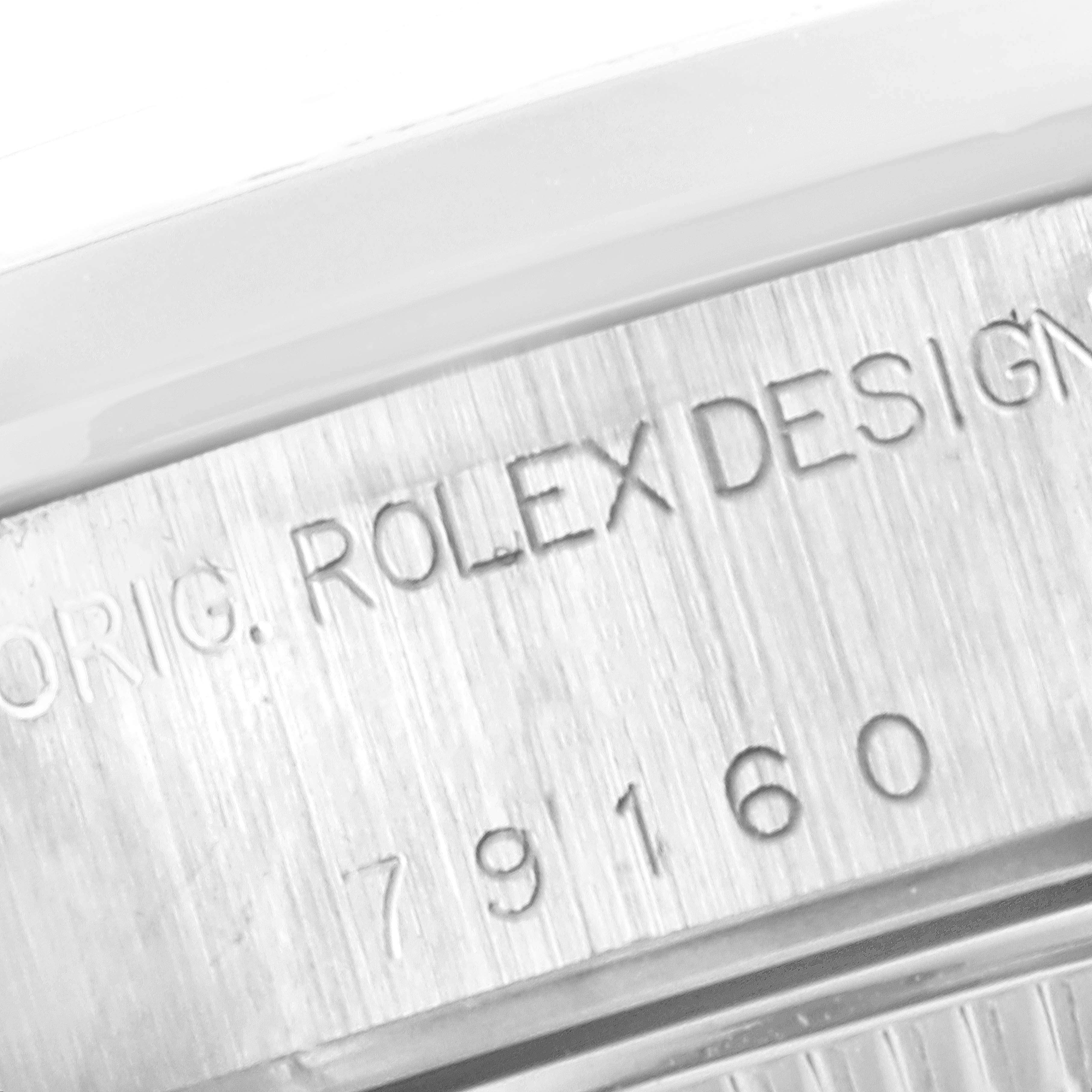 This image shows a close-up of the engraved case side of a Rolex Date 79160 Women's Stainless Steel Pink Dial 79160 Women's Stainless Steel Pink Dial model watch, displaying part of the model number.