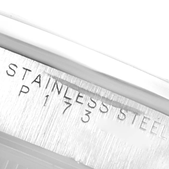 This close-up image shows the stainless steel engraving and part of the serial number of a Rolex Date 15200 Men's Stainless Steel Black Dial 15200 Men's Stainless Steel Black Dial model watch.