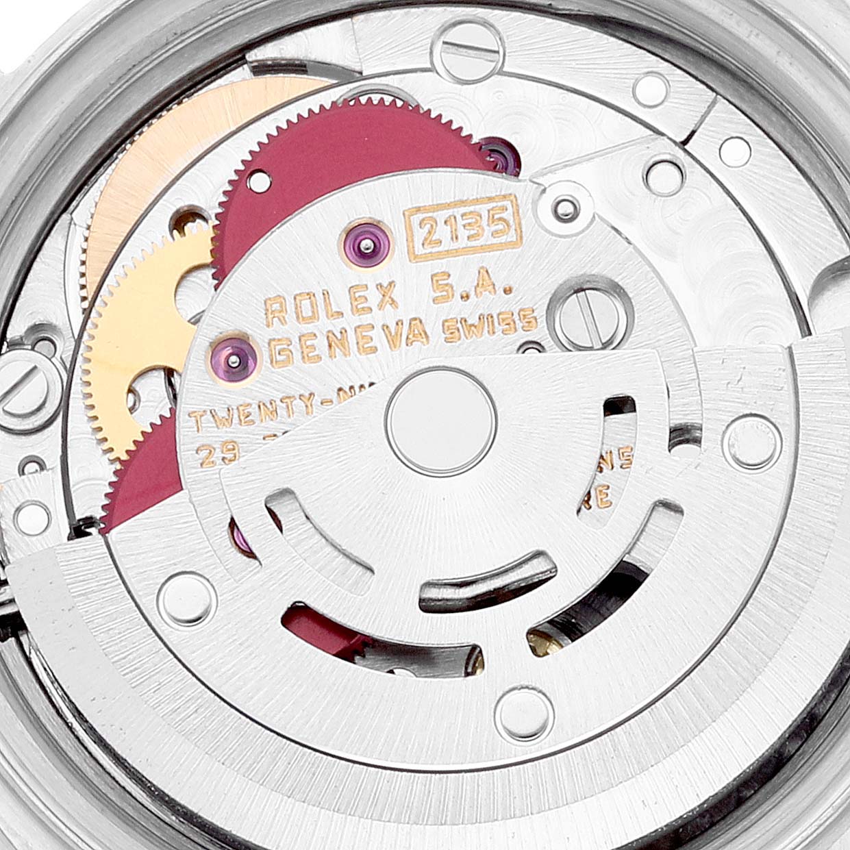 The image shows a close-up of the movement of a Rolex Datejust 69173 Women's Steel and Gold (two tone) Black Dial 69173 Women's Steel and Gold (two tone) Black Dial watch, displaying gears and engraved details.