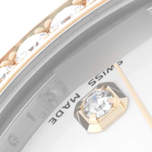 The image shows a close-up of the dial and bezel of a Rolex Datejust watch, including a diamond hour marker and part of the "Swiss Made" text.