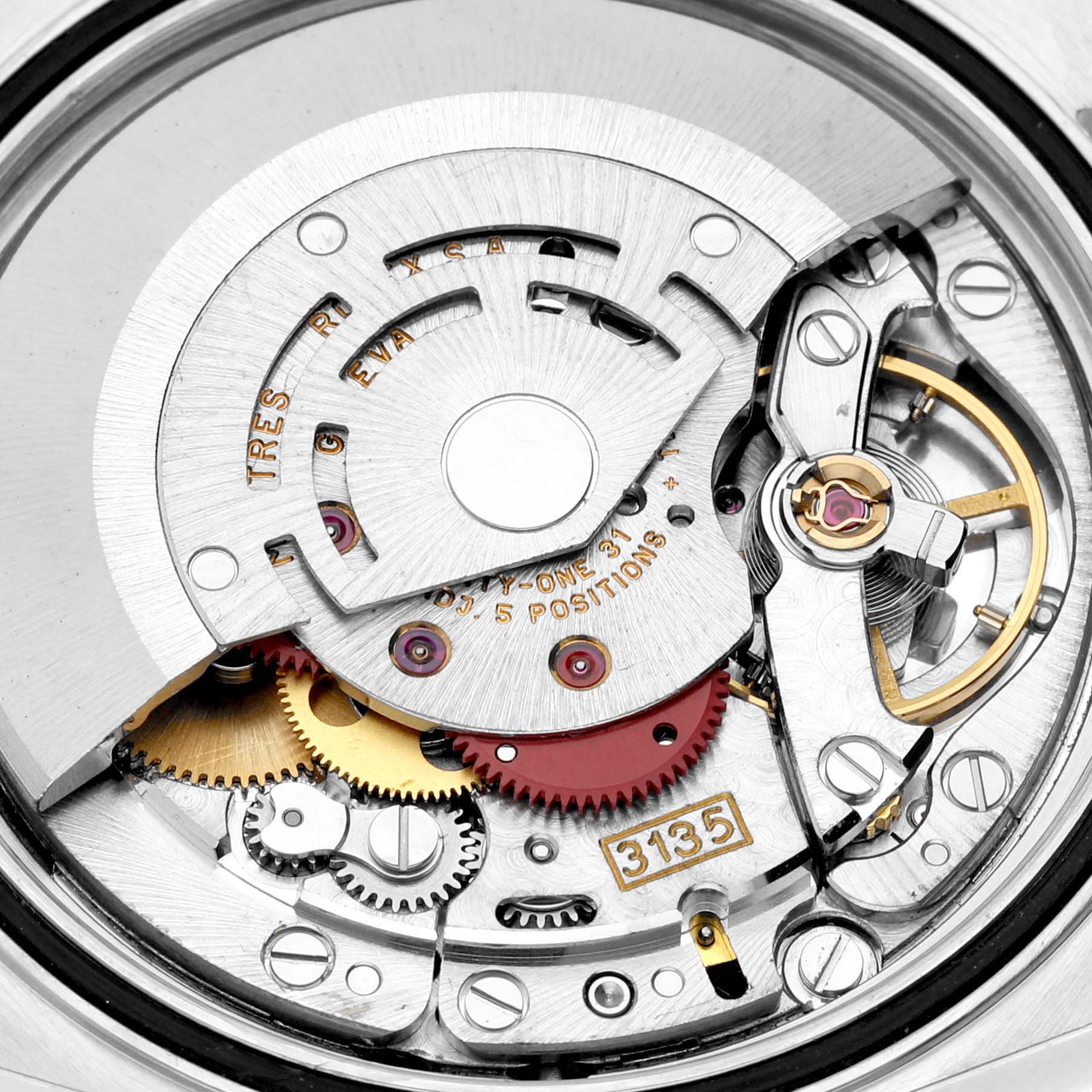 This is a close-up of the Rolex Datejust 16233 Men's Steel and Gold (two tone) Black Dial 16233 Men's Steel and Gold (two tone) Black Dial watch's internal mechanism, highlighting its intricate gears and components.