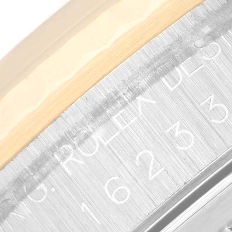 The image shows a close-up view of the engraved inner bezel of a Rolex Datejust 16233 Men's Steel and Gold (two tone) Black Dial 16233 Men's Steel and Gold (two tone) Black Dial watch.