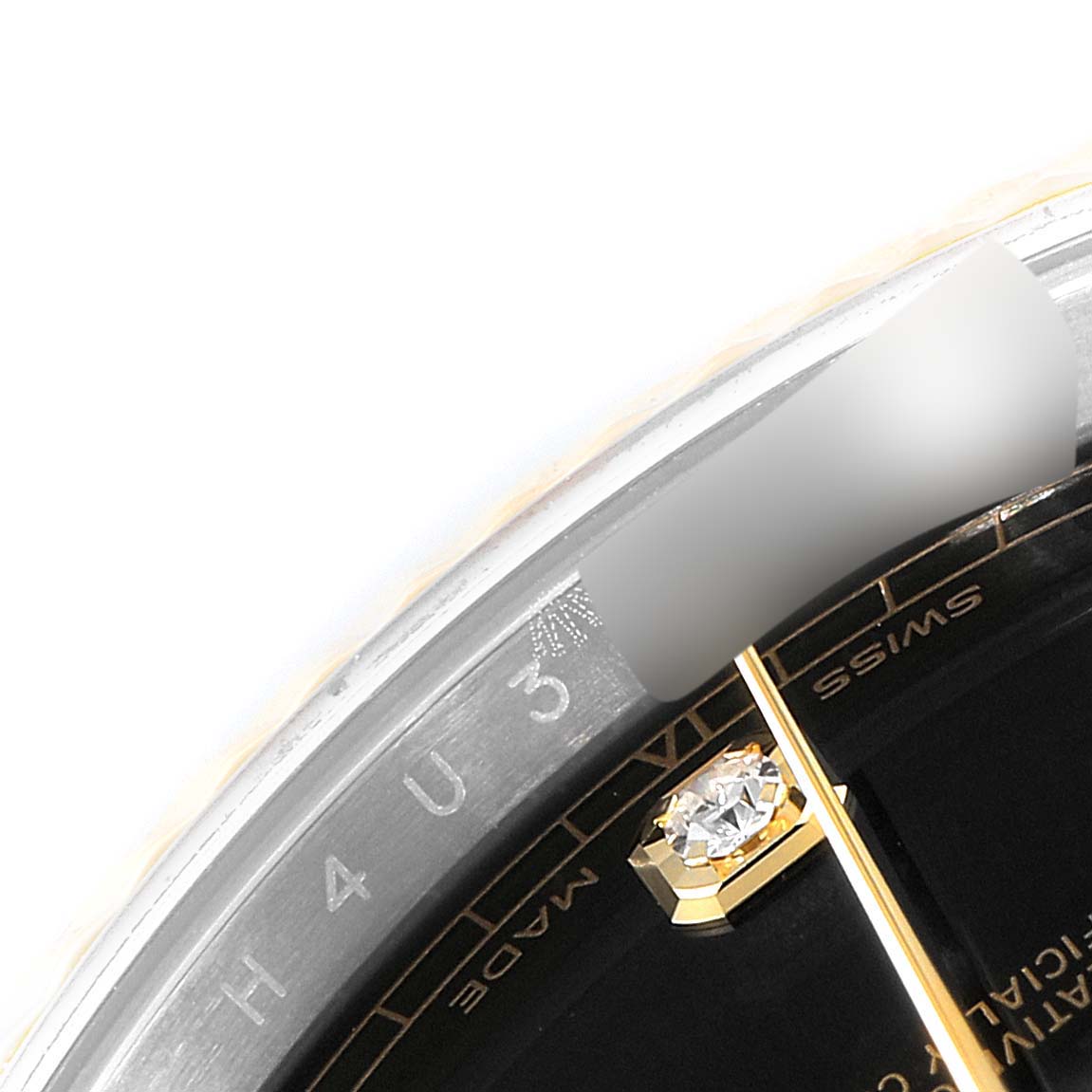This image shows a close-up of the dial and part of the bezel of a Rolex Datejust 41 126333 Men's Steel and Gold (two tone) Black Dial 126333 Men's Steel and Gold (two tone) Black Dial watch, highlighting the "Swiss Made" text and a diamond marker.