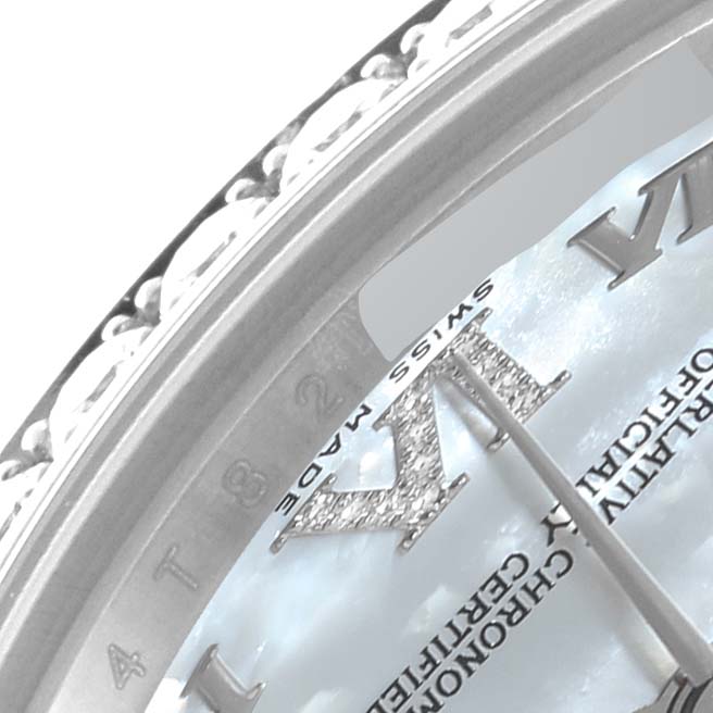 This close-up image shows a portion of the dial, the Roman numeral VI, and part of the bezel of a Rolex Mid-Size 178384 Women's Stainless Steel Mother of Pearl Dial 178384 Women's Stainless Steel Mother of Pearl Dial model wristwatch.