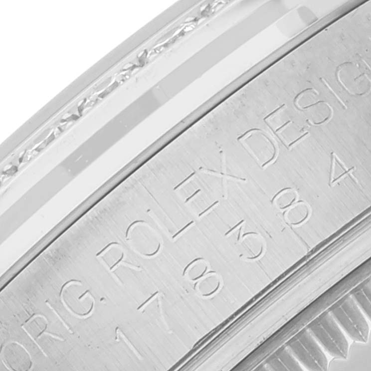 This close-up image shows the engraved details on the side of a Mid-Size Rolex watch case.