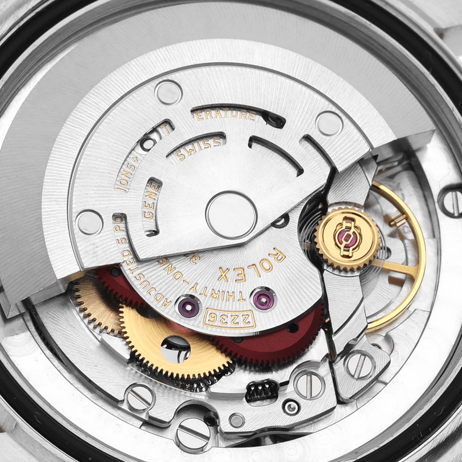 This is a close-up of the internal mechanism of a Mid-Size Rolex watch, showing gears and the rotor.