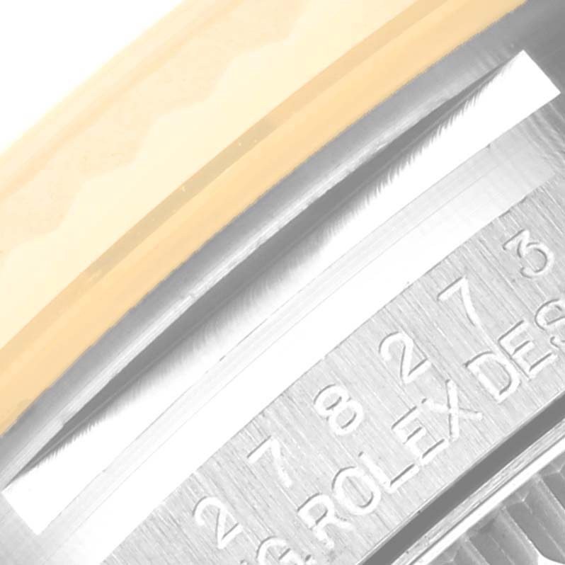 The image shows a close-up of the side profile and part of the engraved inner bezel of a Rolex Mid-Size 278273 Women's Steel and Gold (two tone) Green Dial 278273 Women's Steel and Gold (two tone) Green Dial model watch.