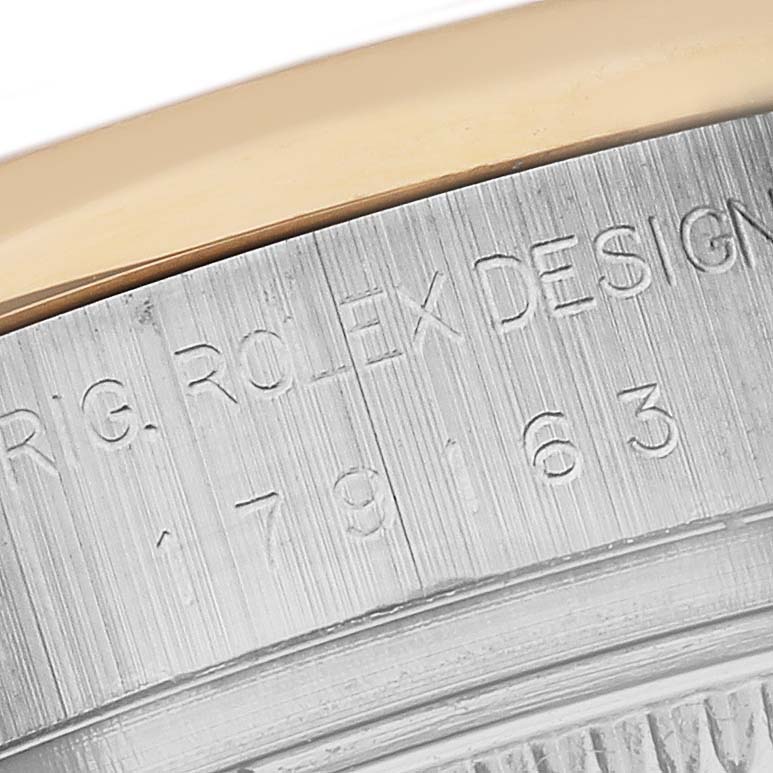 This is a close-up shot of the Rolex Datejust 179163 Women's Steel and Gold (two tone) Silver Dial 179163 Women's Steel and Gold (two tone) Silver Dial case, showing the model number engraving.