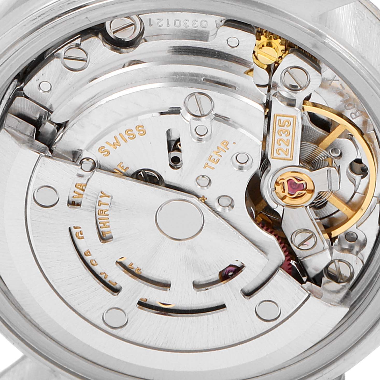 The image shows the internal mechanism of a Rolex Datejust 79174 Women's Stainless Steel Silver Dial 79174 Women's Stainless Steel Silver Dial watch at a close-up angle, highlighting its intricate movement parts.