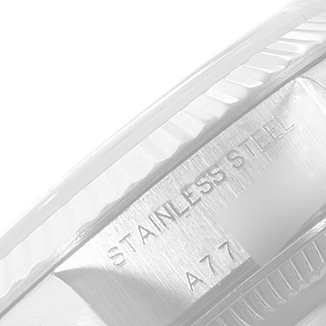 This image shows a close-up angle of the side case and bezel of a Rolex Datejust 79174 Women's Stainless Steel Silver Dial 79174 Women's Stainless Steel Silver Dial watch, with "STAINLESS STEEL" engraved.