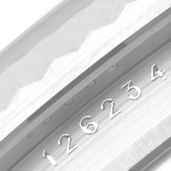 This image shows a close-up view of the serial number engraving on the bezel of a Rolex Datejust 126234 Men
s Stainless Steel Silver Dial 126234 Men
s Stainless Steel Silver Dial watch.