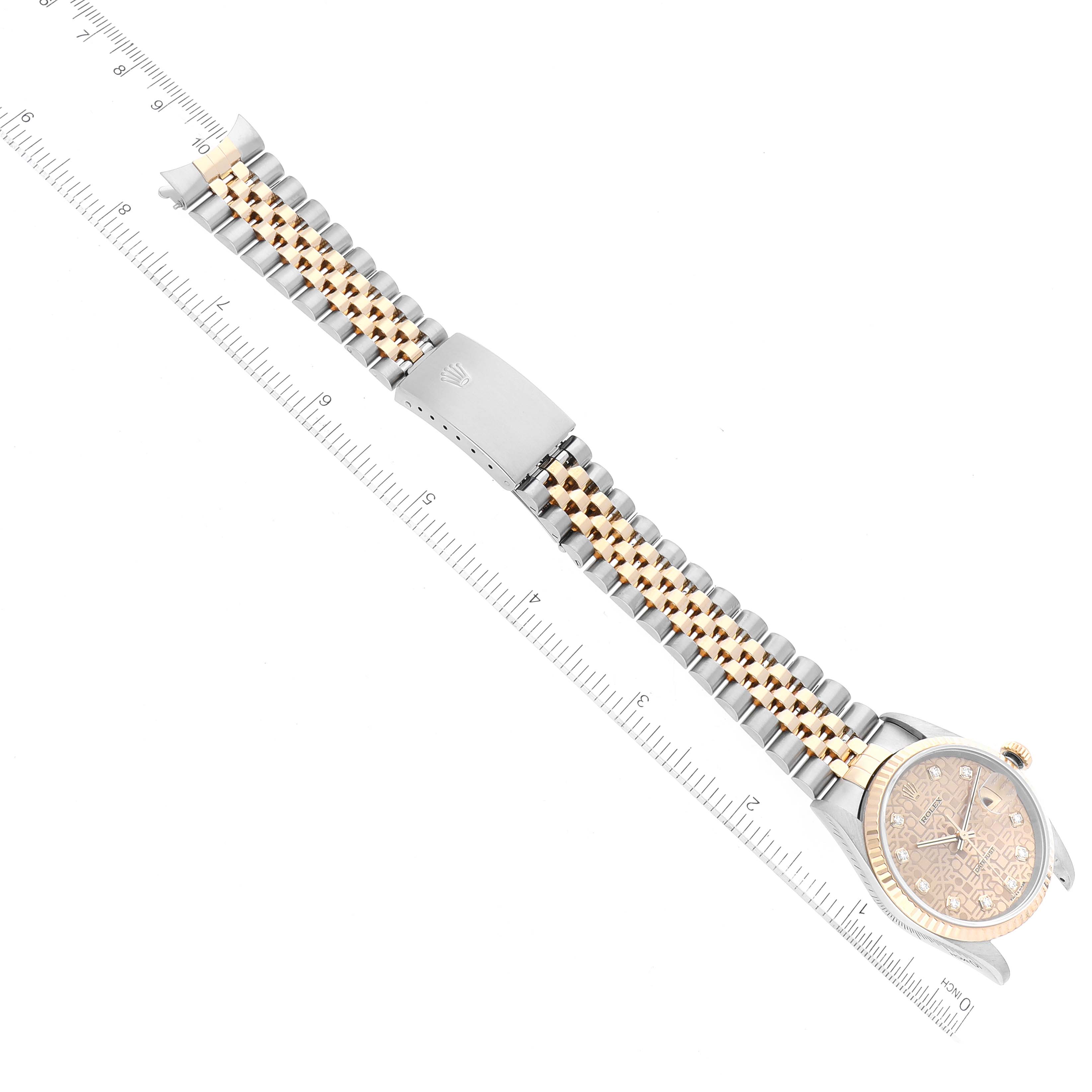 The image shows a top-down view of a Rolex Datejust 16233 Men's Steel and Gold (two tone) Champagne Dial 16233 Men's Steel and Gold (two tone) Champagne Dial watch, highlighting its band, clasp, and part of the face.