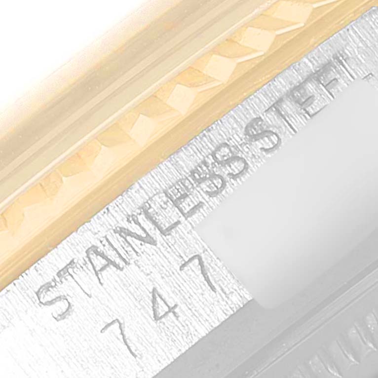 This image shows a close-up of the engraved text and bezel detailing on a Rolex Vintage Collection 16013 Men's Steel and Gold (two tone) Champagne Dial 16013 Men's Steel and Gold (two tone) Champagne Dial model watch.