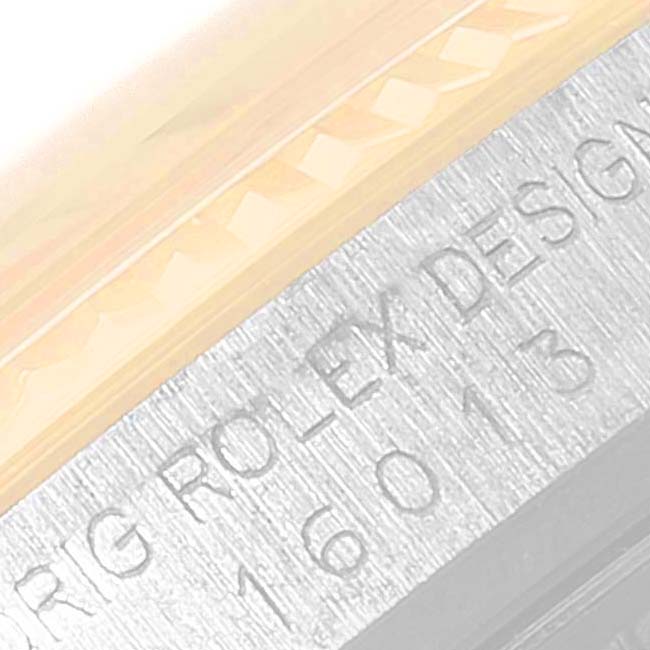 This image shows a close-up of the side of the bezel and part of the case with model number engravings on a Vintage Collection Rolex watch.