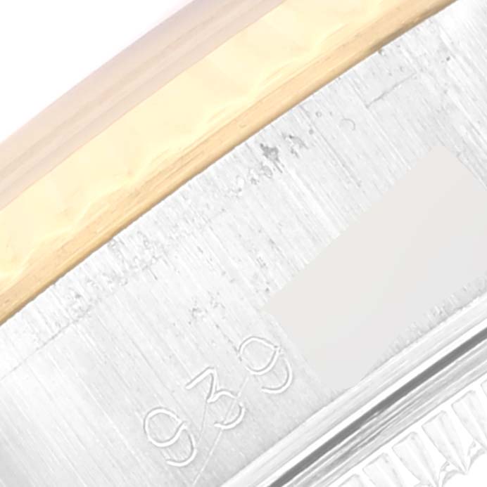 This image shows a close-up of the gold and steel case edge of a Rolex Datejust 69173 Women's Steel and Gold (two tone) Champagne Dial 69173 Women's Steel and Gold (two tone) Champagne Dial watch.