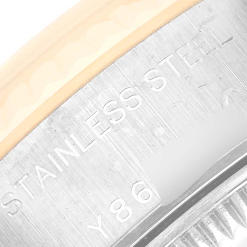 The image shows a close-up of the side of the Rolex Datejust 79173NR Women's Steel and Gold (two tone) Mother of Pearl Dial 79173NR Women's Steel and Gold (two tone) Mother of Pearl Dial watch case, highlighting the "STAINLESS STEEL" engraving.