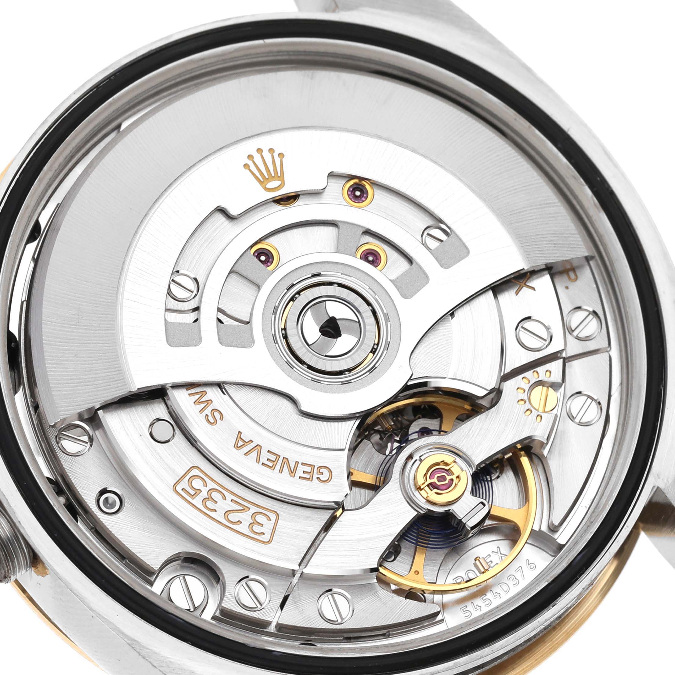 This image shows a close-up of the movement inside a Rolex Datejust 126203 Men
s Steel and Gold (two tone) Grey Dial 126203 Men
s Steel and Gold (two tone) Grey Dial watch, highlighting its intricate inner components.