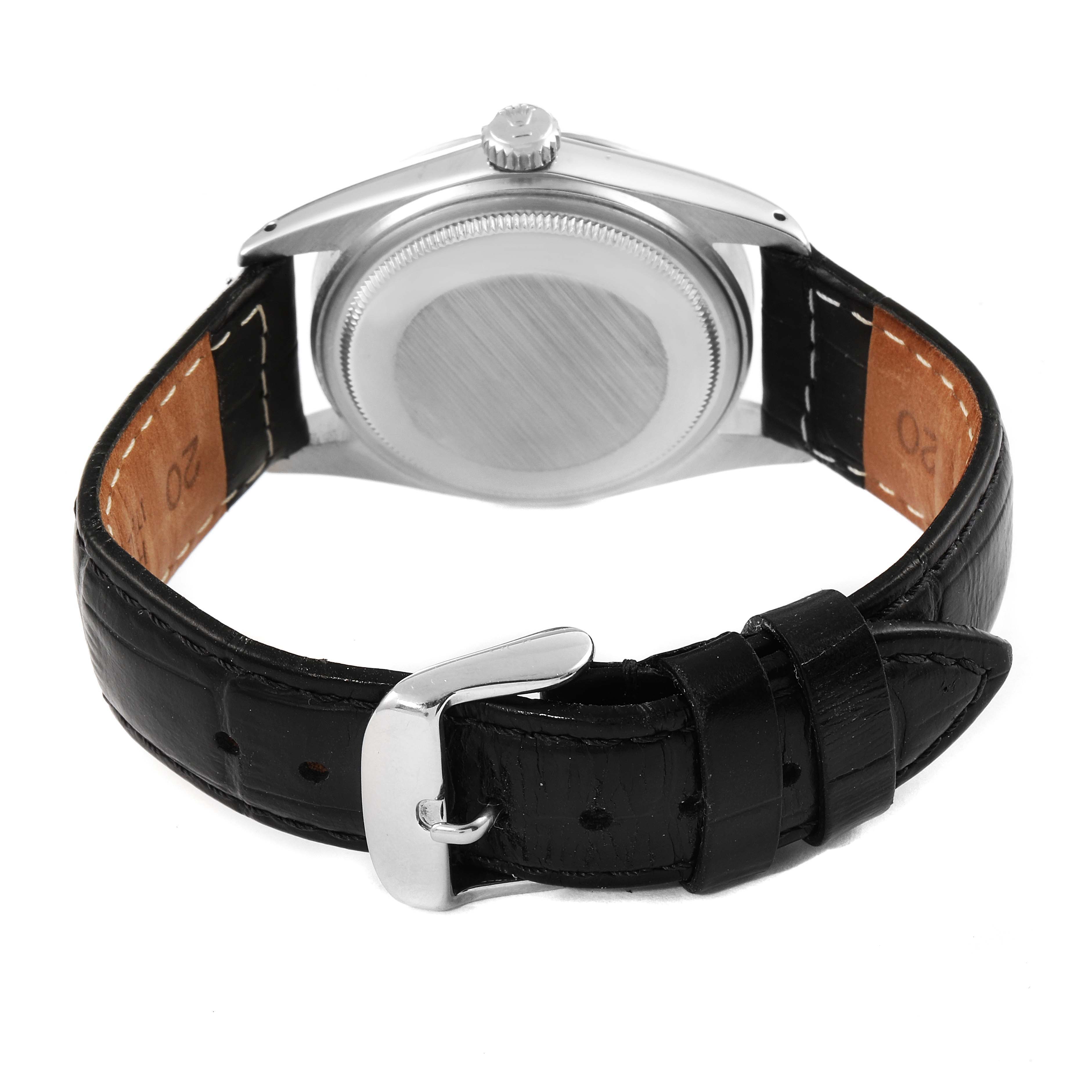 The image shows the back view of a Rolex Vintage Collection 16014 Men's Stainless Steel Black Dial 16014 Men's Stainless Steel Black Dial model watch, highlighting the case and black leather strap with a buckle.