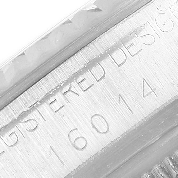 This image shows a close-up of the case side of a Rolex Vintage Collection 16014 Men's Stainless Steel Black Dial 16014 Men's Stainless Steel Black Dial watch, featuring the engraved "REGISTERED DESIGN” and “16014” markings.