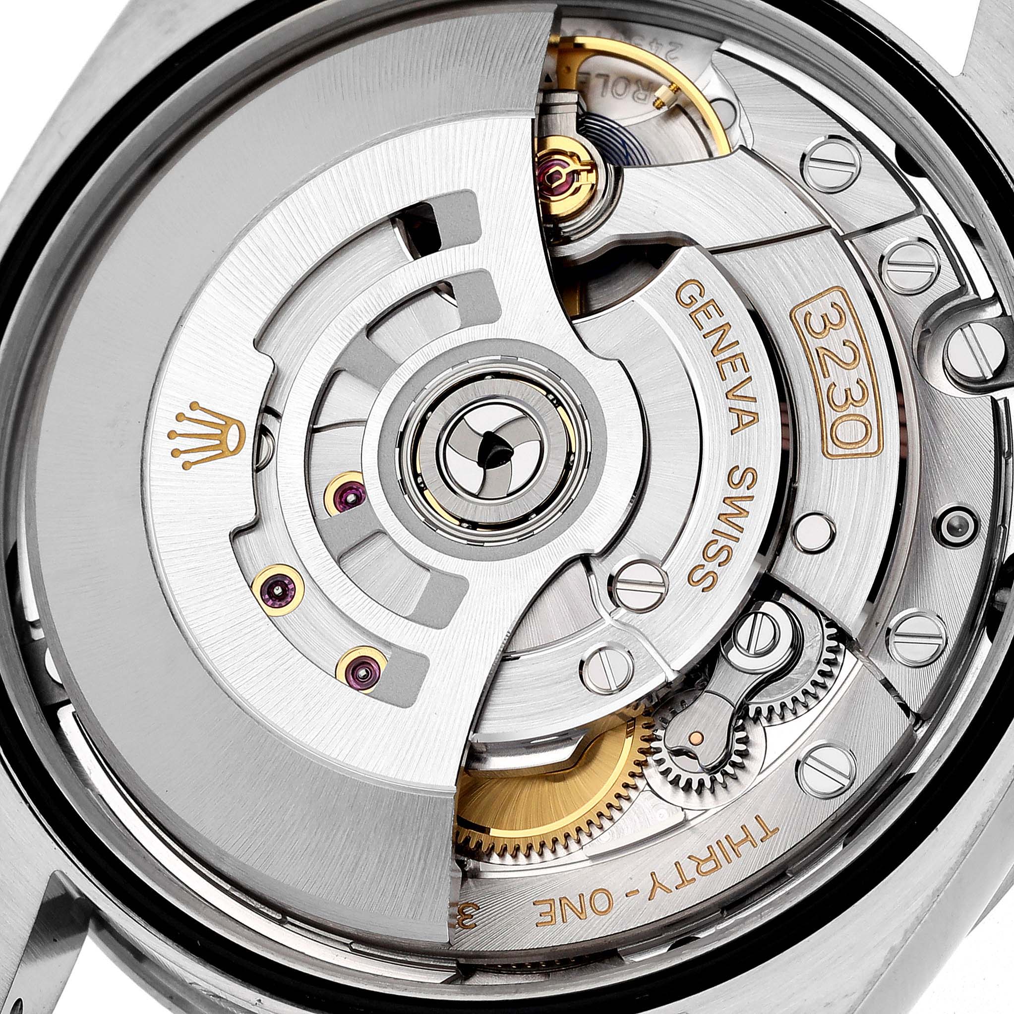 The image shows a close-up view of the movement mechanism of a Rolex Explorer 124270 Men
s Stainless Steel Black Dial 124270 Men
s Stainless Steel Black Dial watch, highlighting intricate gears and components.