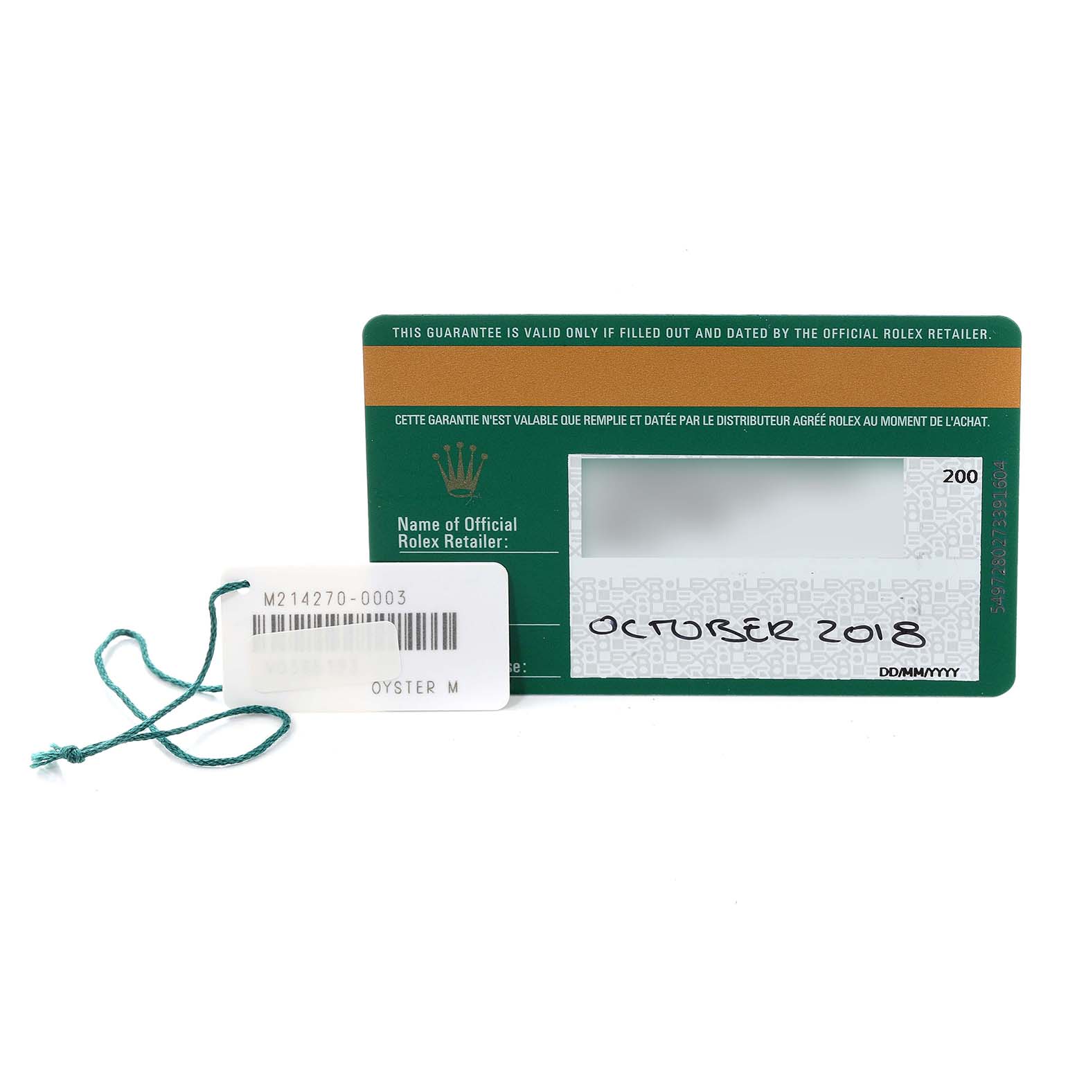 The image shows a Rolex Explorer 214270 Men
s Stainless Steel Black Dial 214270 Men
s Stainless Steel Black Dial model warranty card with a barcode tag attached via a green string.