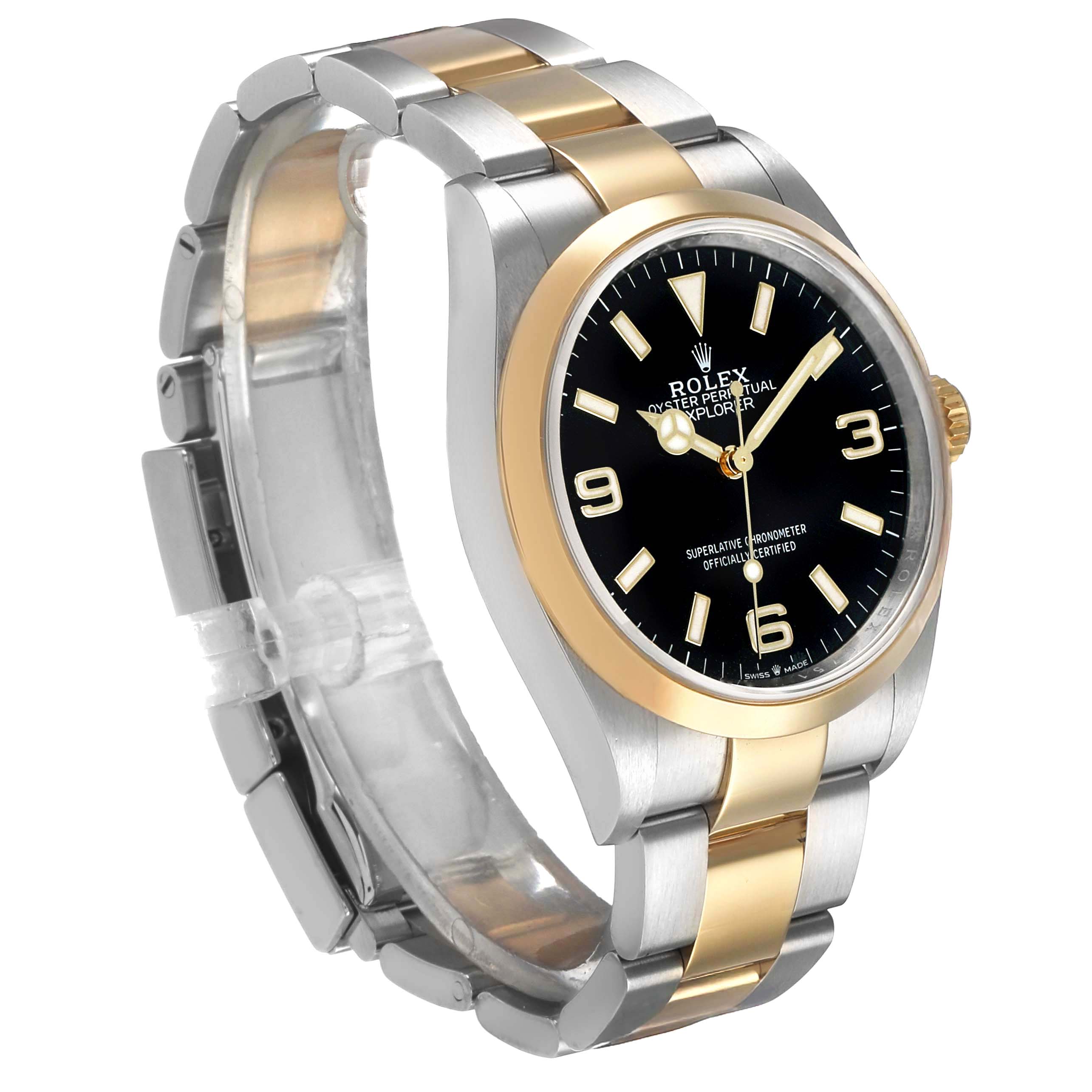 The image shows a side angle of a Rolex Explorer 124273 Men's Steel and Gold (two tone) Black Dial watch, highlighting the two-tone bracelet, bezel, and black dial with luminescent markers.