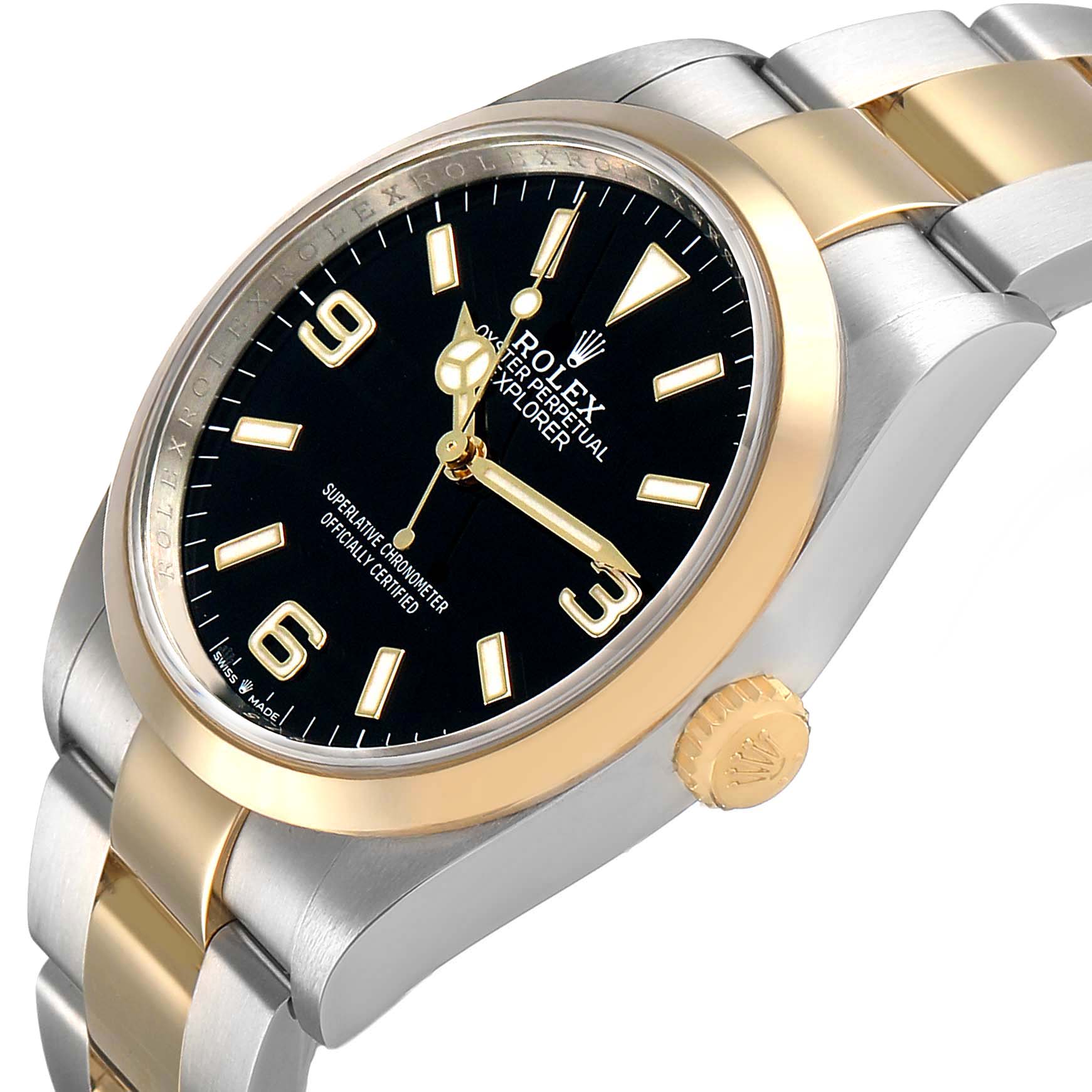 The Rolex Explorer 124273 Men's Steel and Gold (two tone) Black Dial watch is shown from a side angle, highlighting its gold and silver bracelet and black dial with numerals.