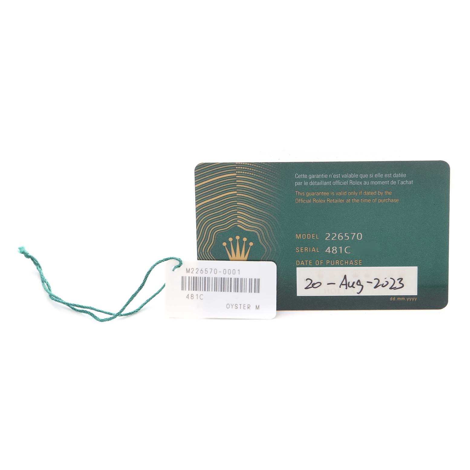 The image shows a Rolex Explorer 226570 Men
s Stainless Steel White Dial 226570 Men
s Stainless Steel White Dial model warranty card and tag from above, displaying the model and serial numbers.