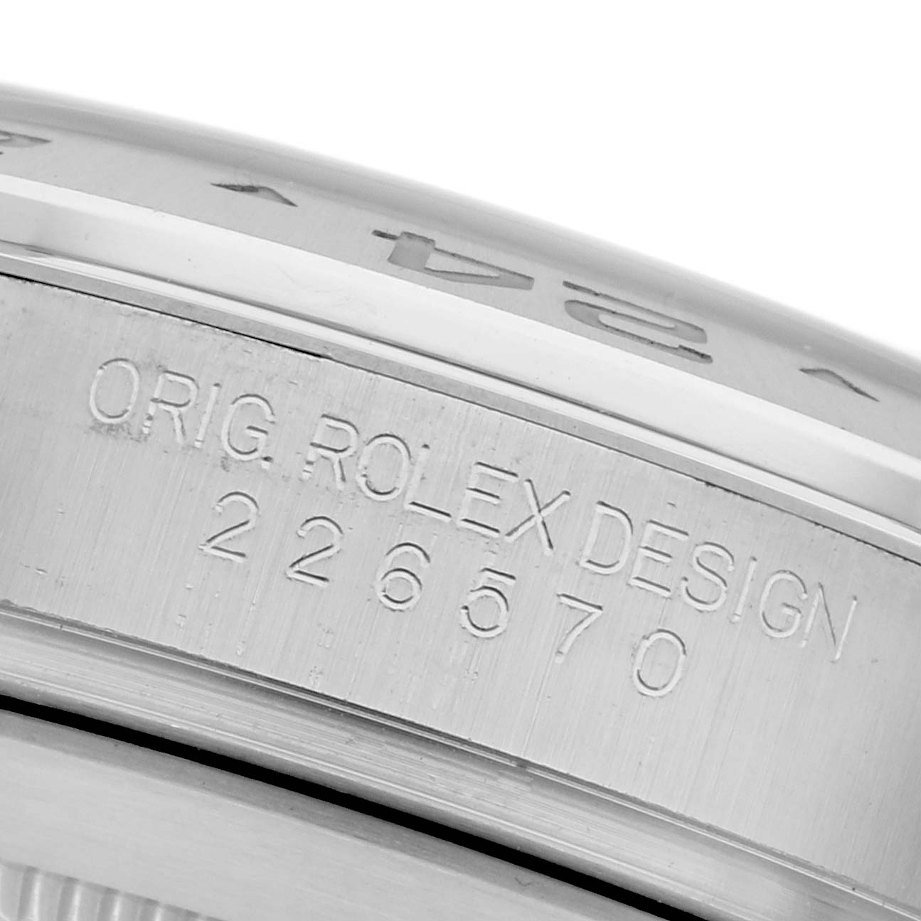 The image shows a close-up of the Rolex Explorer 226570 Men
s Stainless Steel White Dial 226570 Men
s Stainless Steel White Dial
s side, featuring its engraved model number.
