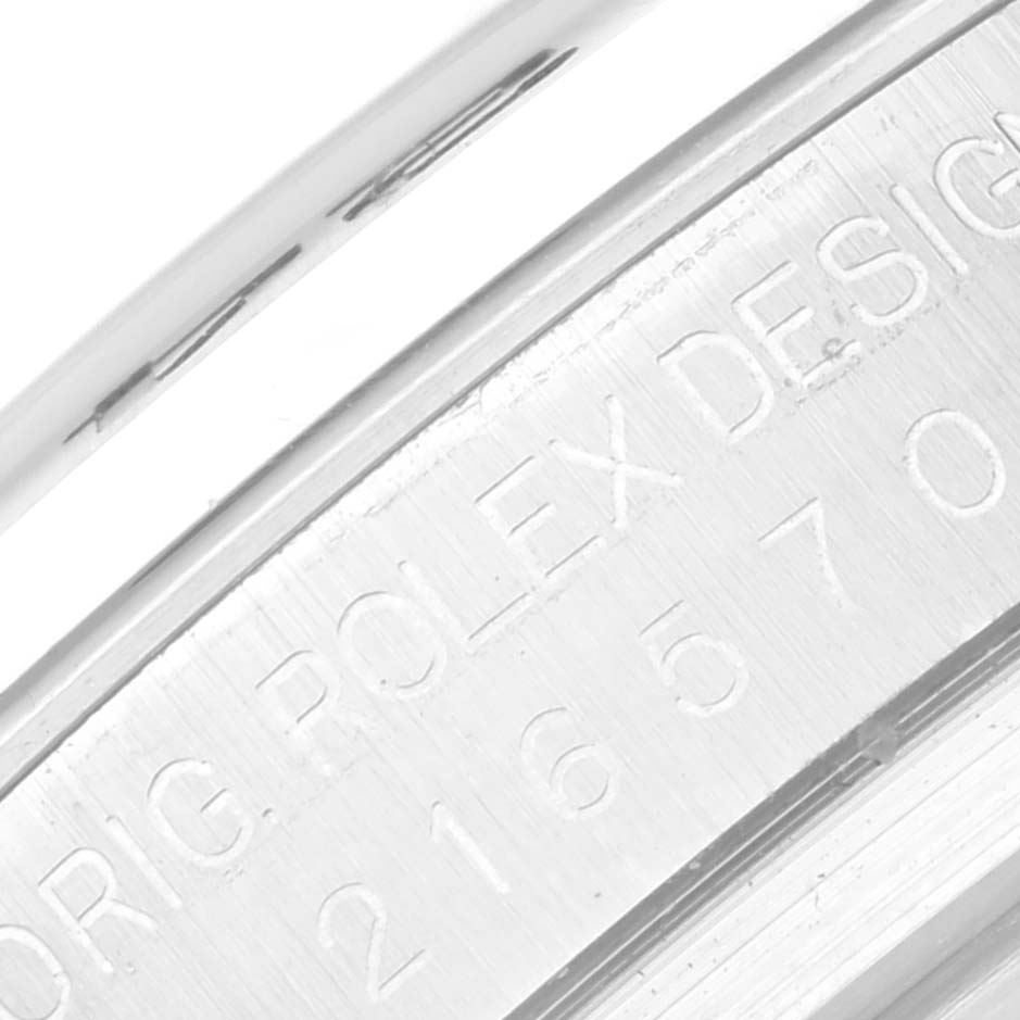 The image shows a close-up of the case with engraved details of a Rolex Explorer 216570 Men
s Stainless Steel White Dial 216570 Men
s Stainless Steel White Dial watch.