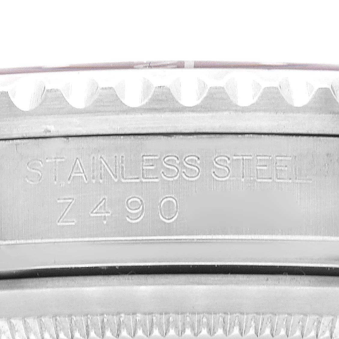 This close-up image shows the engraved stainless steel marking and serial number on the side of a Rolex GMT-Master 16710 Men
s Stainless Steel Black Dial 16710 Men
s Stainless Steel Black Dial watch case.