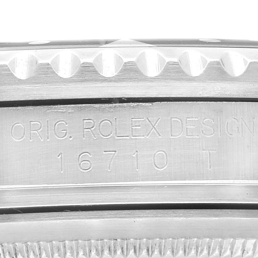 This image shows a close-up of the case side of a Rolex GMT-Master 16710 Men
s Stainless Steel Black Dial 16710 Men
s Stainless Steel Black Dial with model number 16710 engraved.
