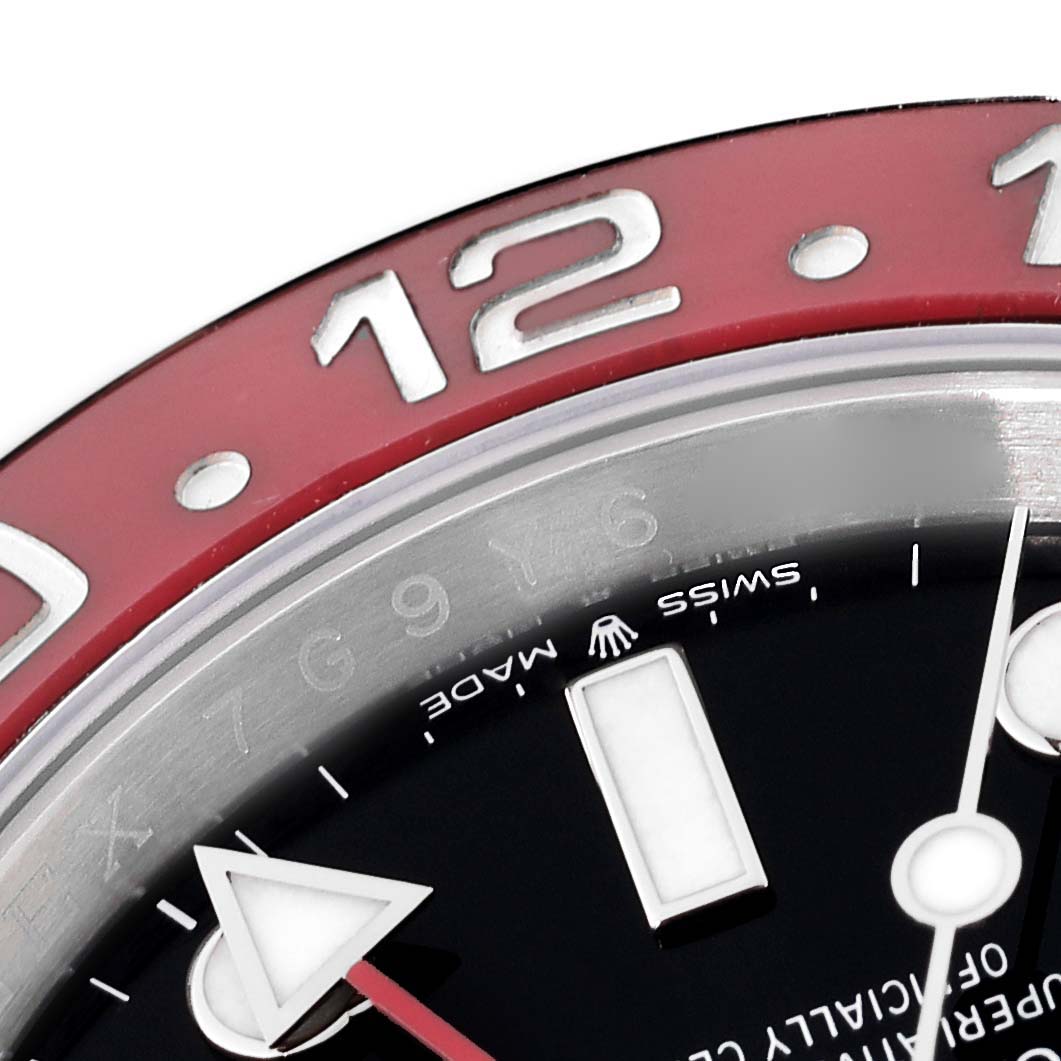 The image shows a close-up of the bezel and part of the dial of a Rolex GMT-Master 126710BLRO Men's Stainless Steel Black Dial 126710BLRO Men's Stainless Steel Black Dial watch.