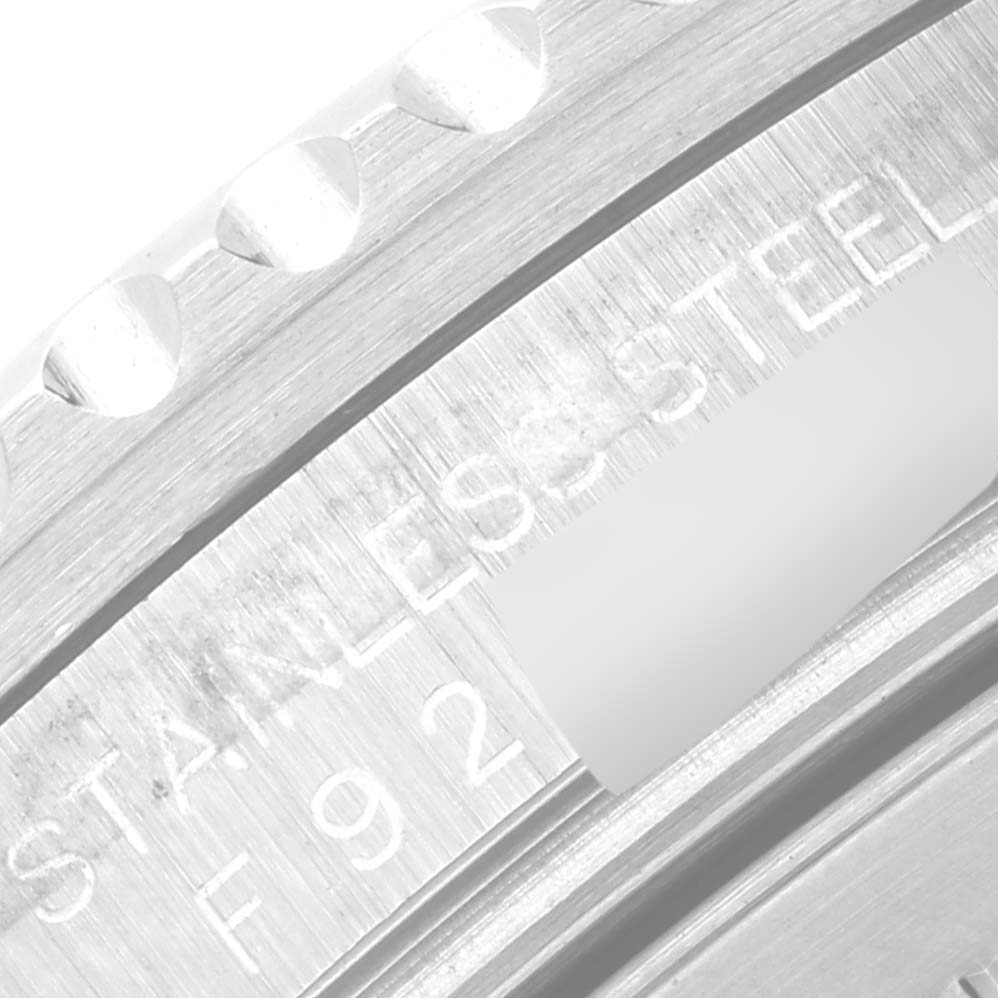 This close-up image shows the bezel and part of the stainless steel casing of a Rolex GMT-Master 16710 Men's Stainless Steel Black Dial 16710 Men's Stainless Steel Black Dial watch.