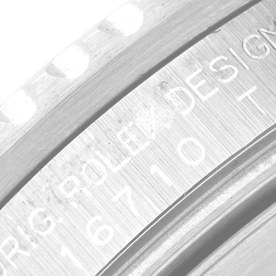 Close-up of the case side and bezel edge of a Rolex GMT-Master 16710 Men's Stainless Steel Black Dial 16710 Men's Stainless Steel Black Dial watch, showing engraved text and design details.
