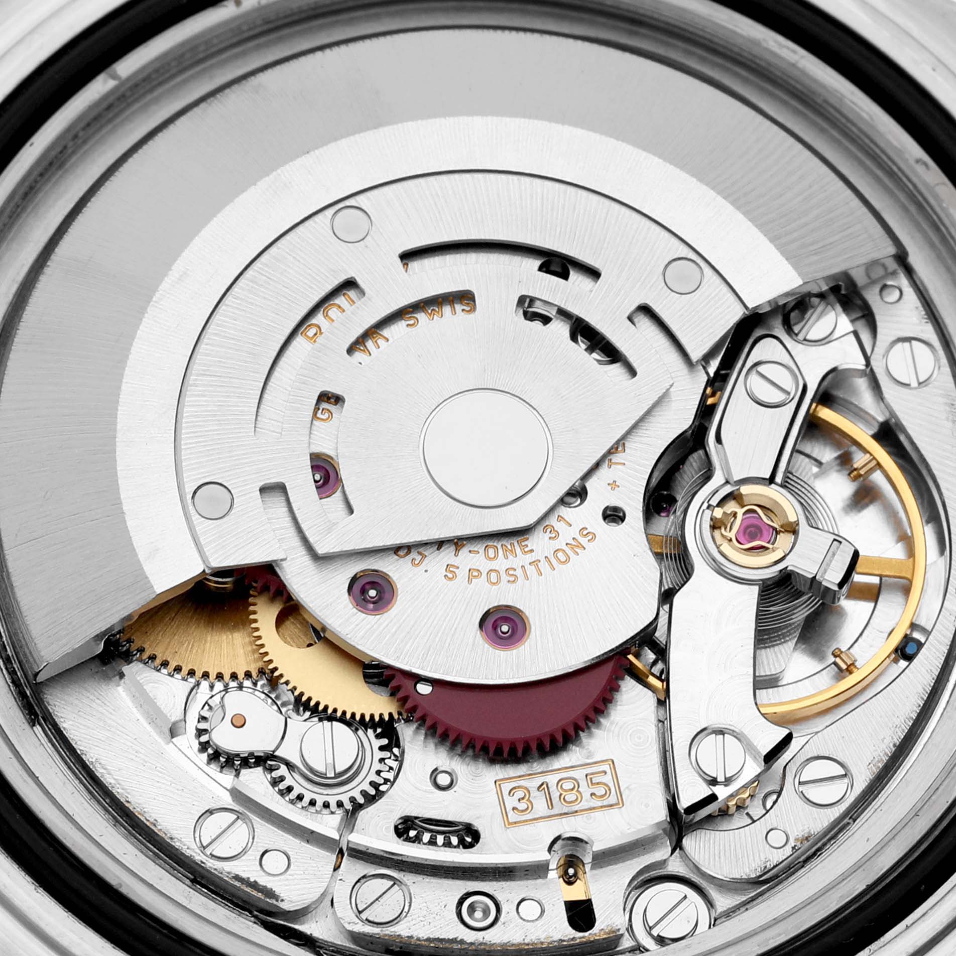 This image shows a close-up view of the intricate internal movement of a Rolex GMT-Master 16710 Men's Stainless Steel Black Dial 16710 Men's Stainless Steel Black Dial watch, revealing gears and mechanical components.