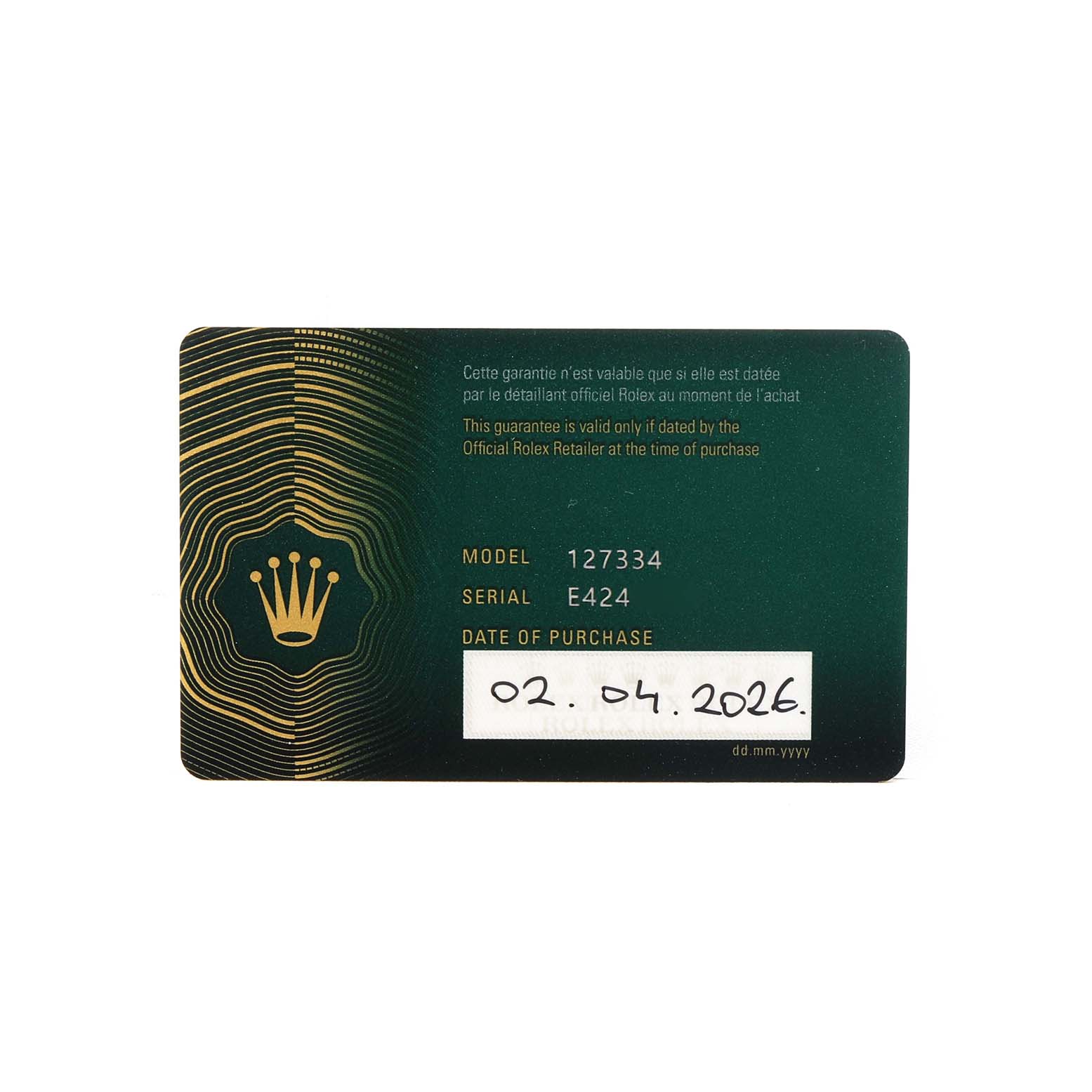 The image shows a warranty card for a Rolex Land‑Dweller 127334 Men's Stainless Steel White Dial, displaying the model number, serial number, and purchase date.