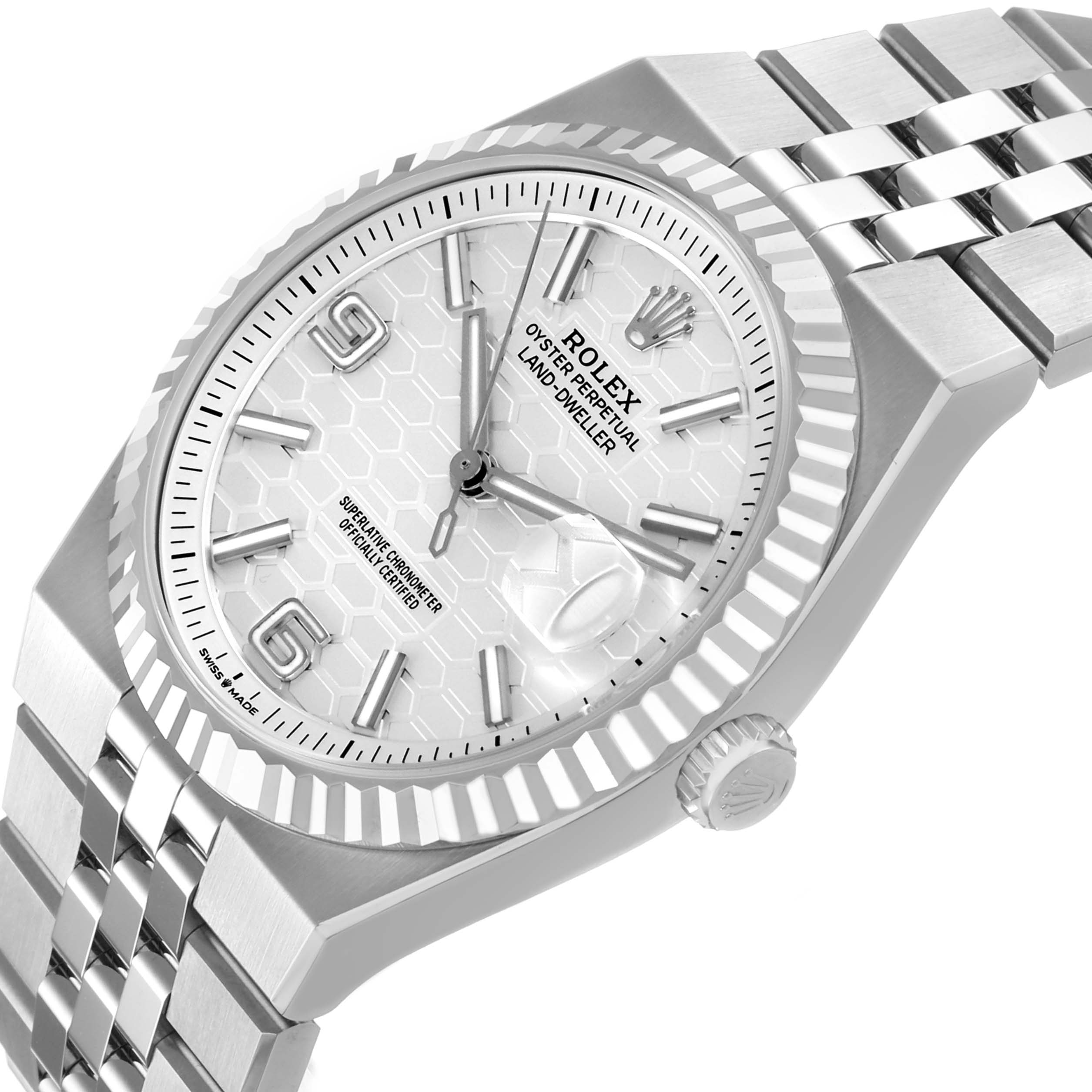 The image shows a close-up of the Rolex Land-Dweller watch at an angled side view, highlighting the dial, bezel, and bracelet.